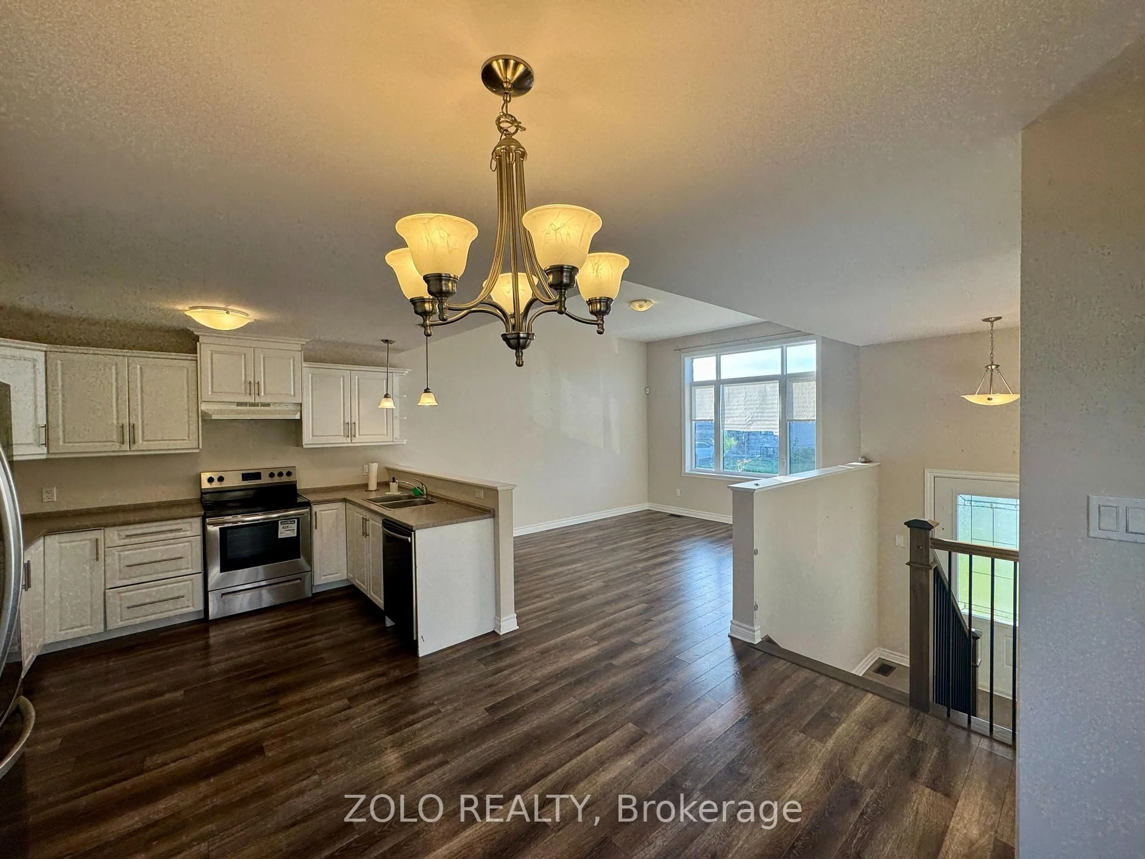 Open concept kitchen, wood/laminate floor for 258 Bellwood Dr, Cornwall Ontario K6H 0H1