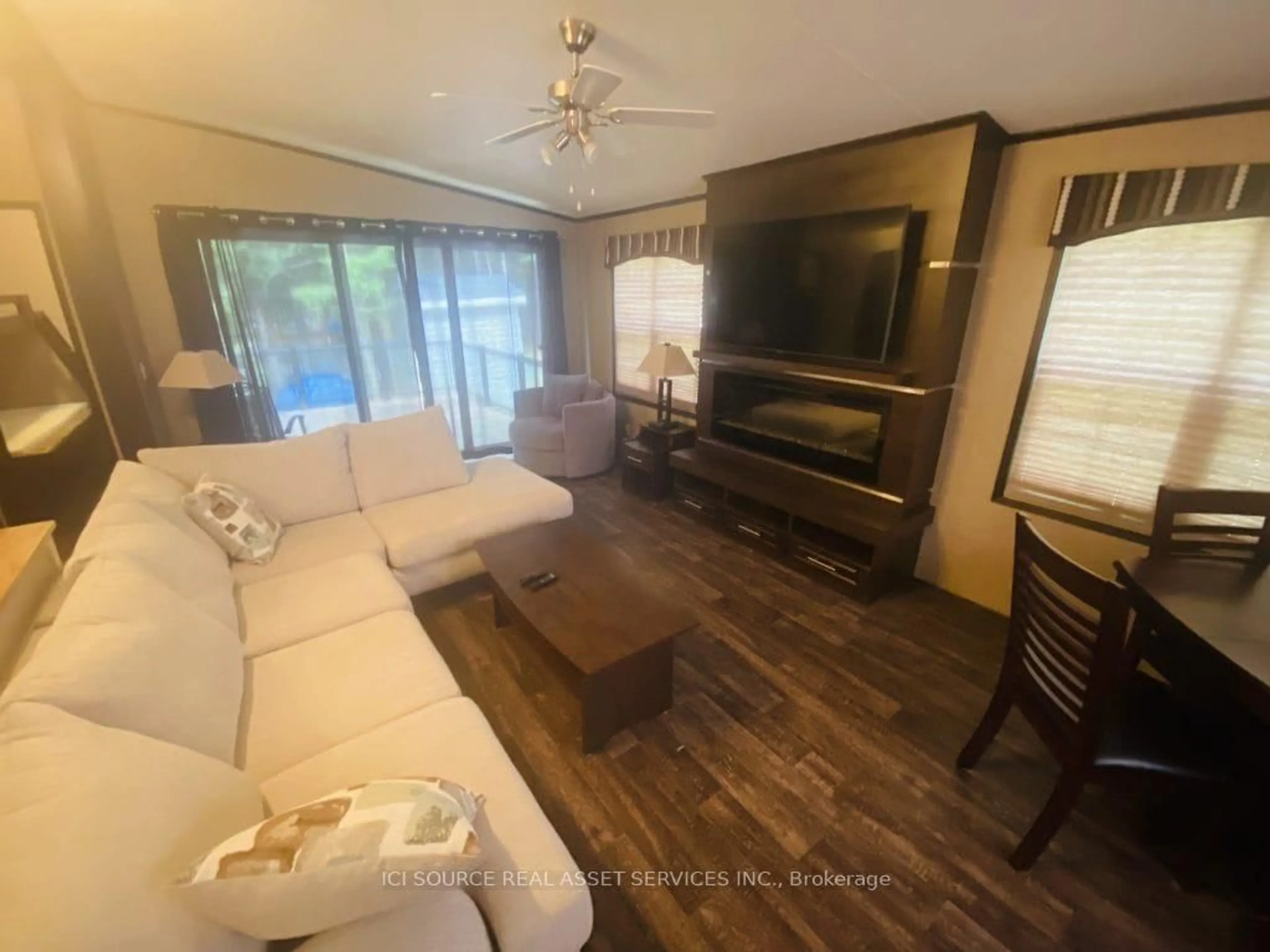 Living room with furniture, wood/laminate floor for 1082 Shamrock Marina Rd #229, Gravenhurst Ontario P0E 1N0
