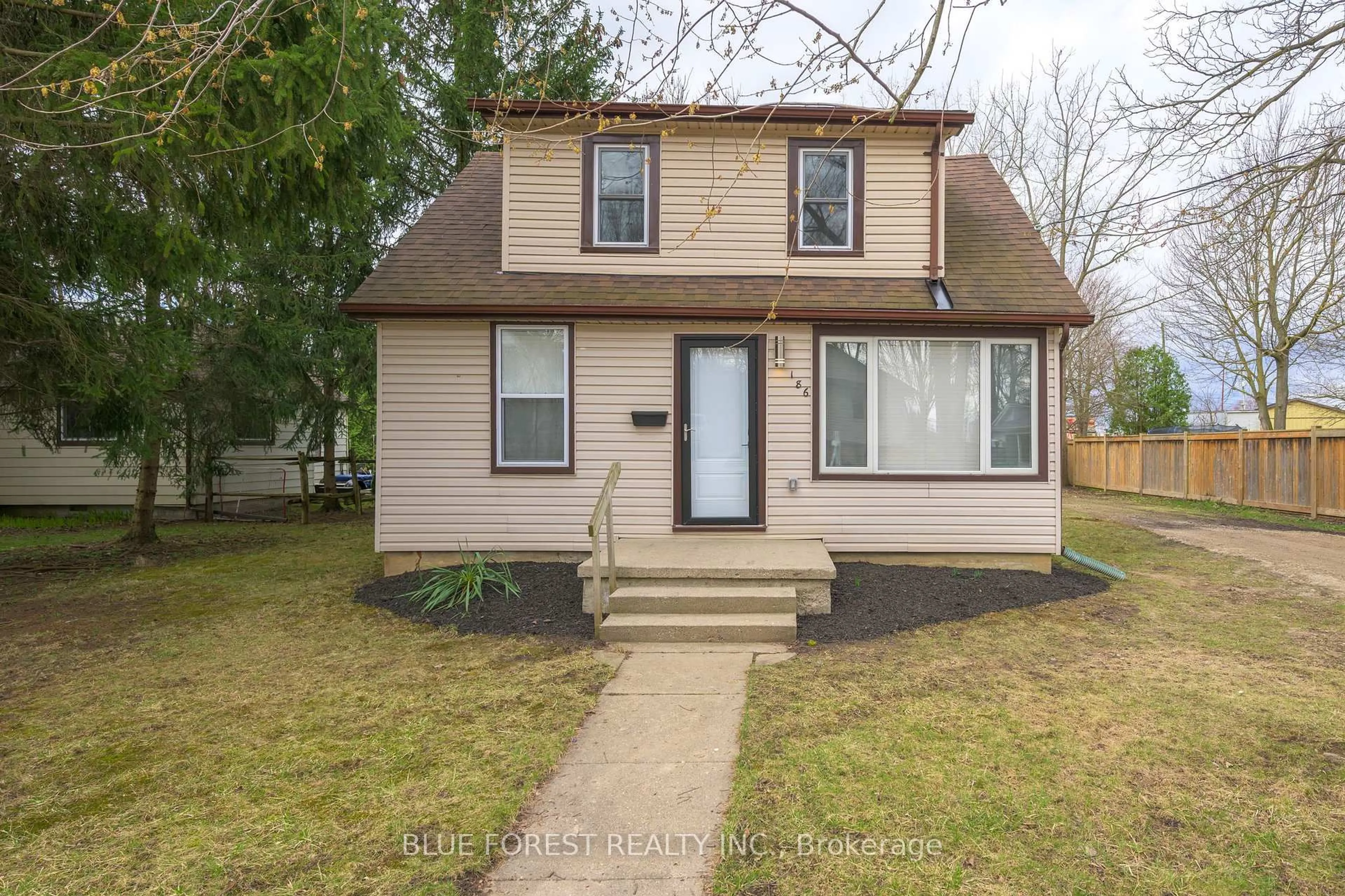 Home with vinyl exterior material, street for 186 Victoria St, Southwest Middlesex Ontario N0L 1M0