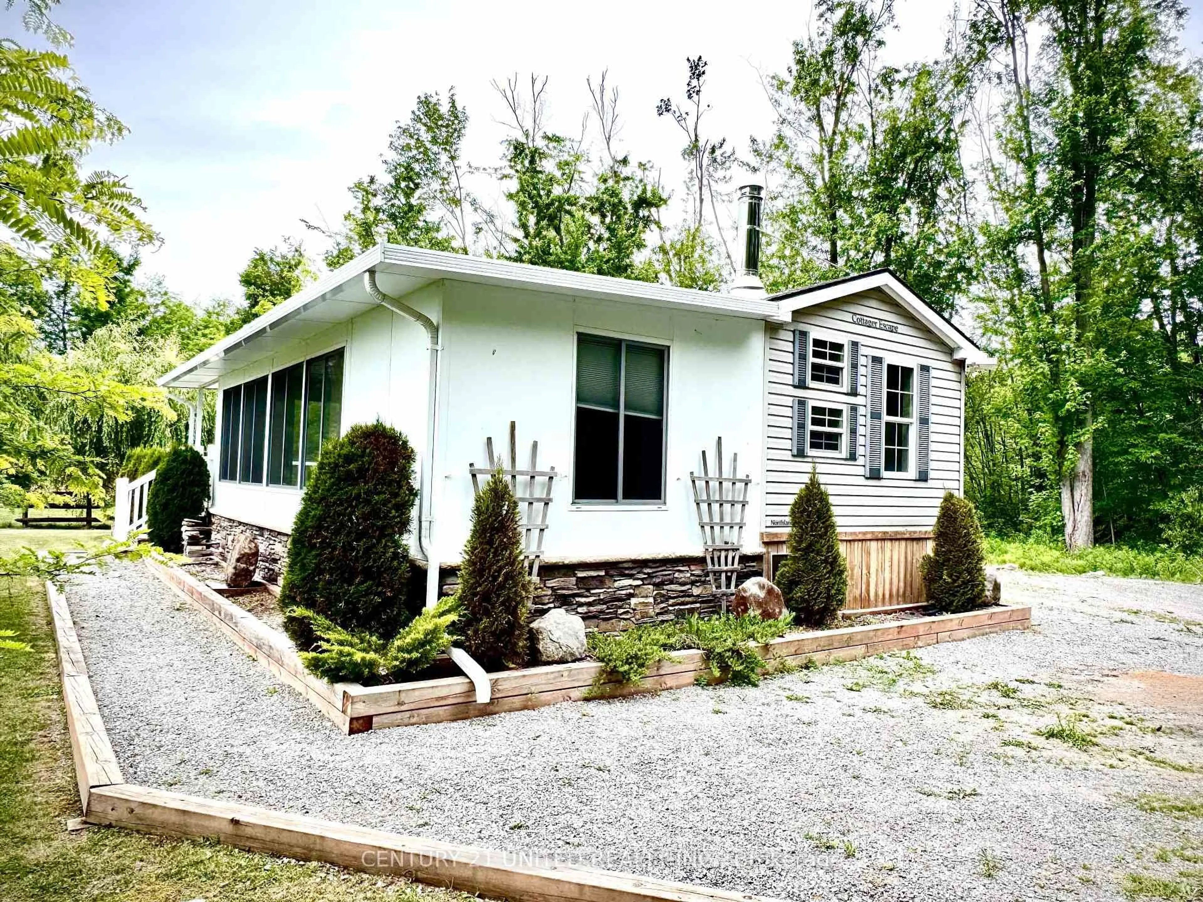 Home with vinyl exterior material, street for 88 Rollie's Bay Rd, Curve Lake First Nation 35 Ontario K0L 1R0