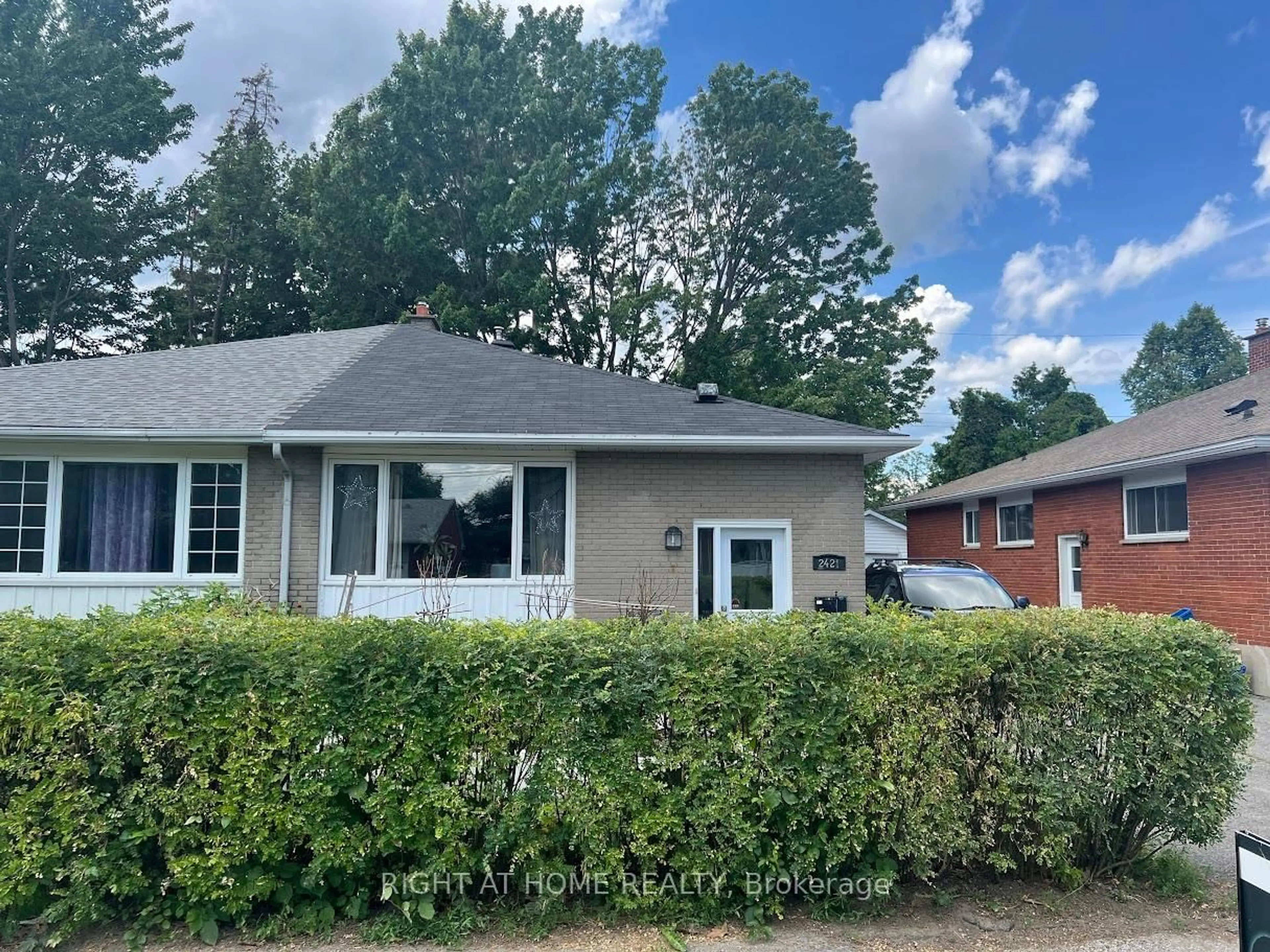 Home with vinyl exterior material, street for 2421 IRIS St, Ottawa Ontario K2C 1C7