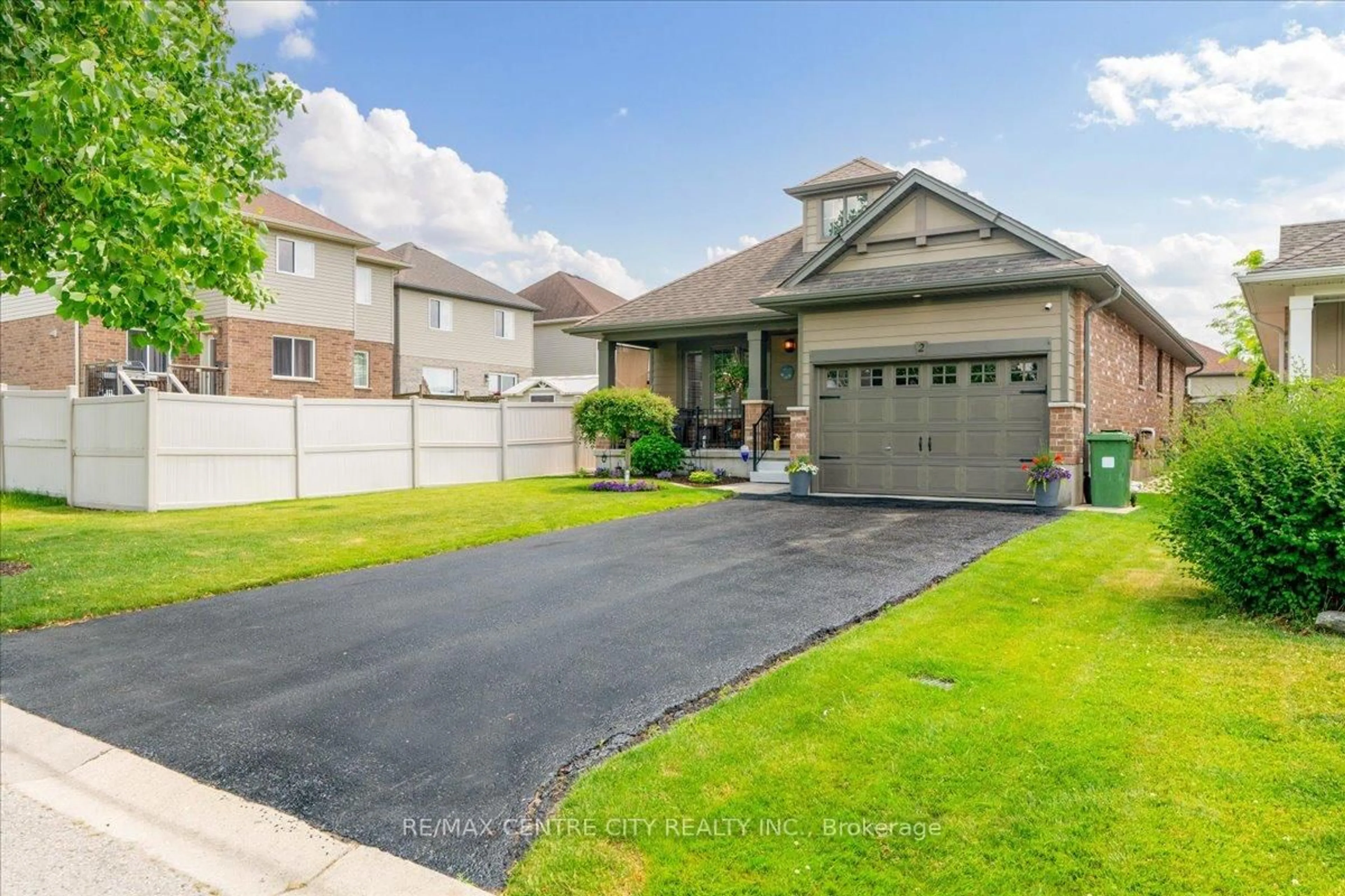 Home with brick exterior material, street for 2 Cherry Blossom Lane, St. Thomas Ontario N5R 1L2