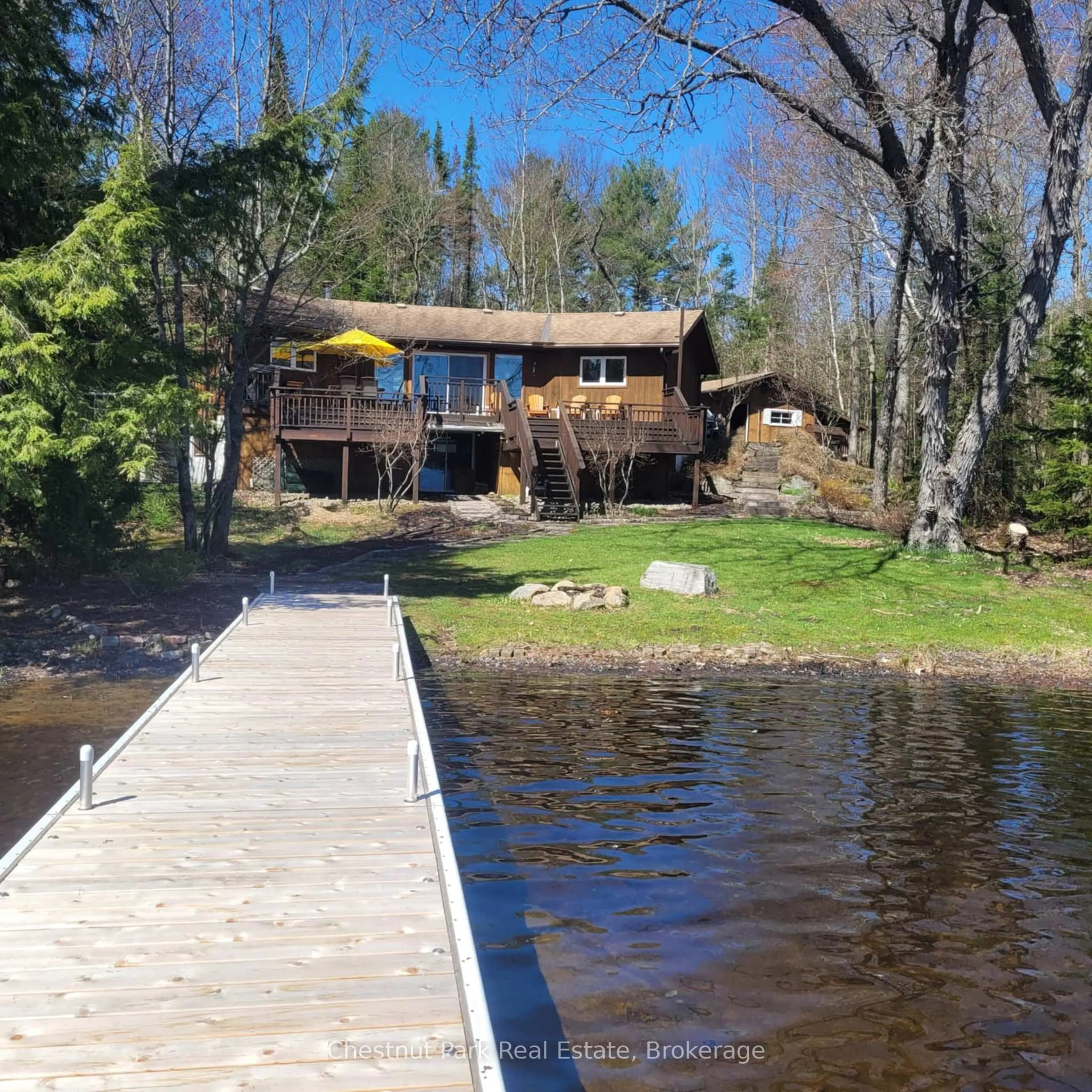 A pic from outside/outdoor area/front of a property/back of a property/a pic from drone, water/lake/river/ocean view for 1183 Dickie Lake Rd, Lake of Bays Ontario P0B 1A0