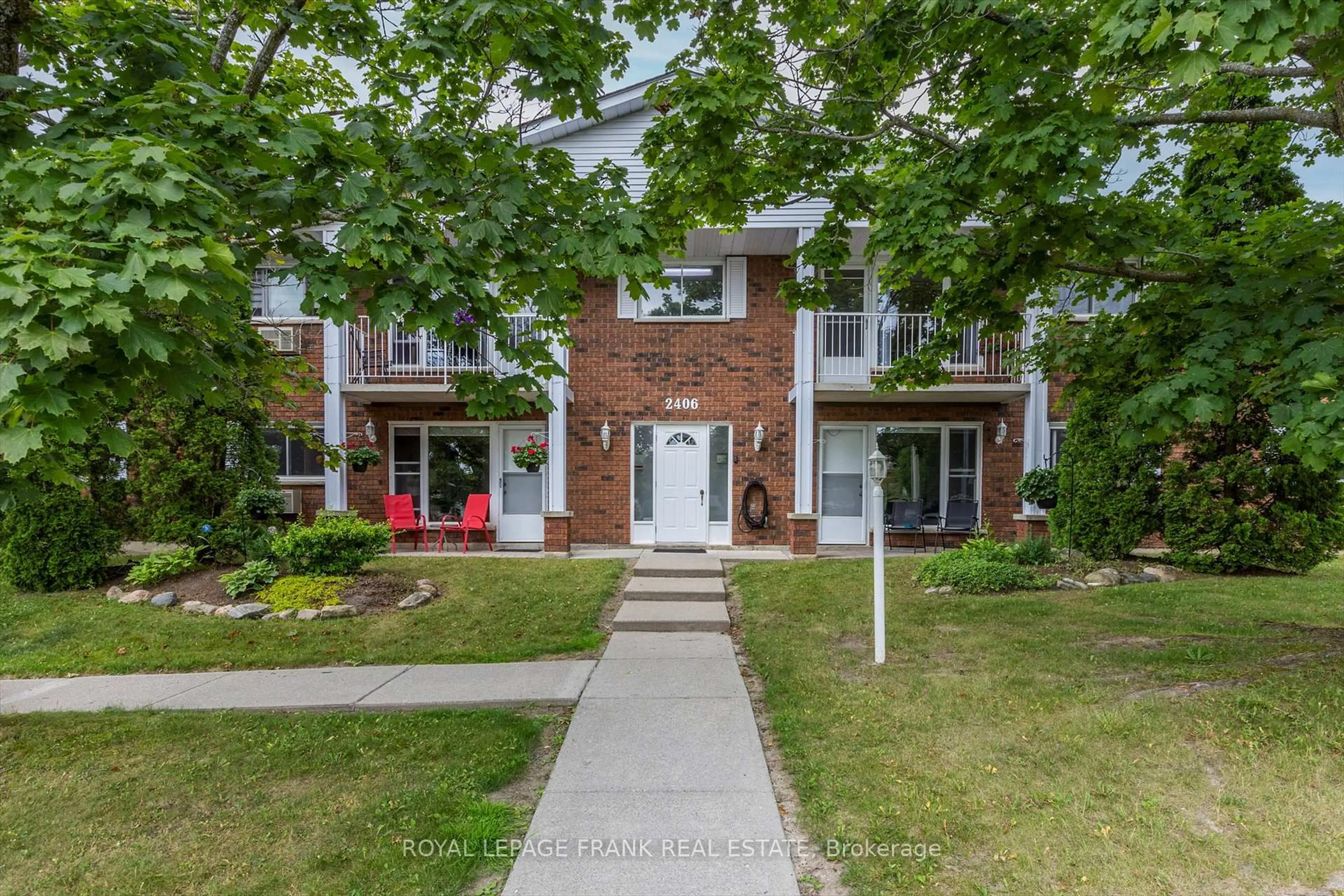 Home with brick exterior material, street for 2406 Mountland Dr #201, Peterborough West Ontario K9K 2E1