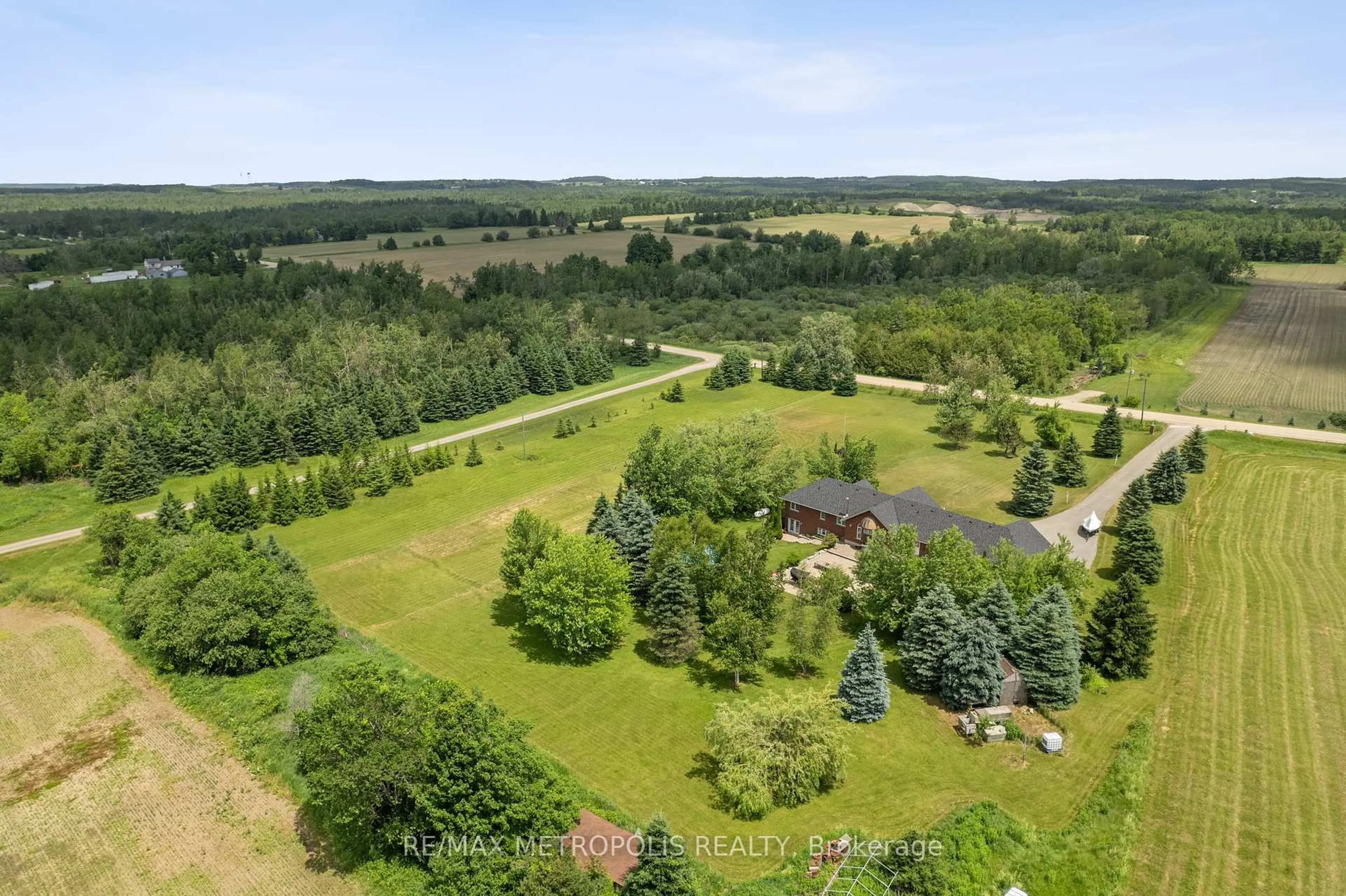 A pic from outside/outdoor area/front of a property/back of a property/a pic from drone, forest/trees view for 595034 Blind Line, Mono Ontario L9W 5N4