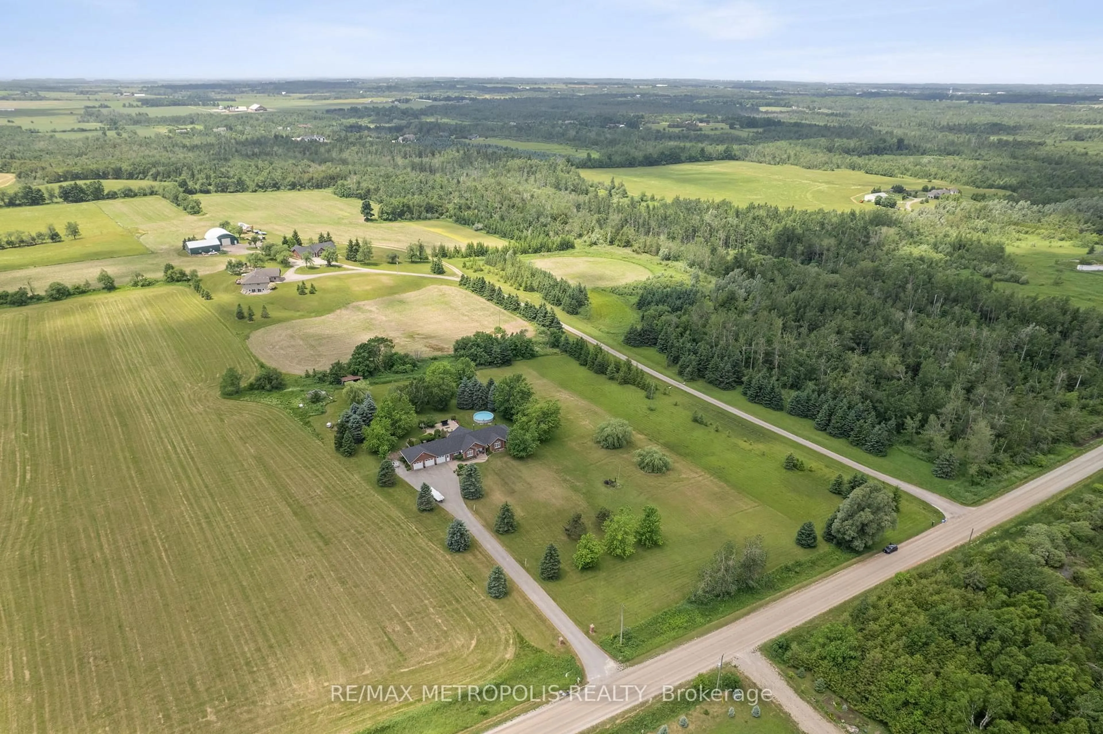 A pic from outside/outdoor area/front of a property/back of a property/a pic from drone, forest/trees view for 595034 Blind Line, Mono Ontario L9W 5N4