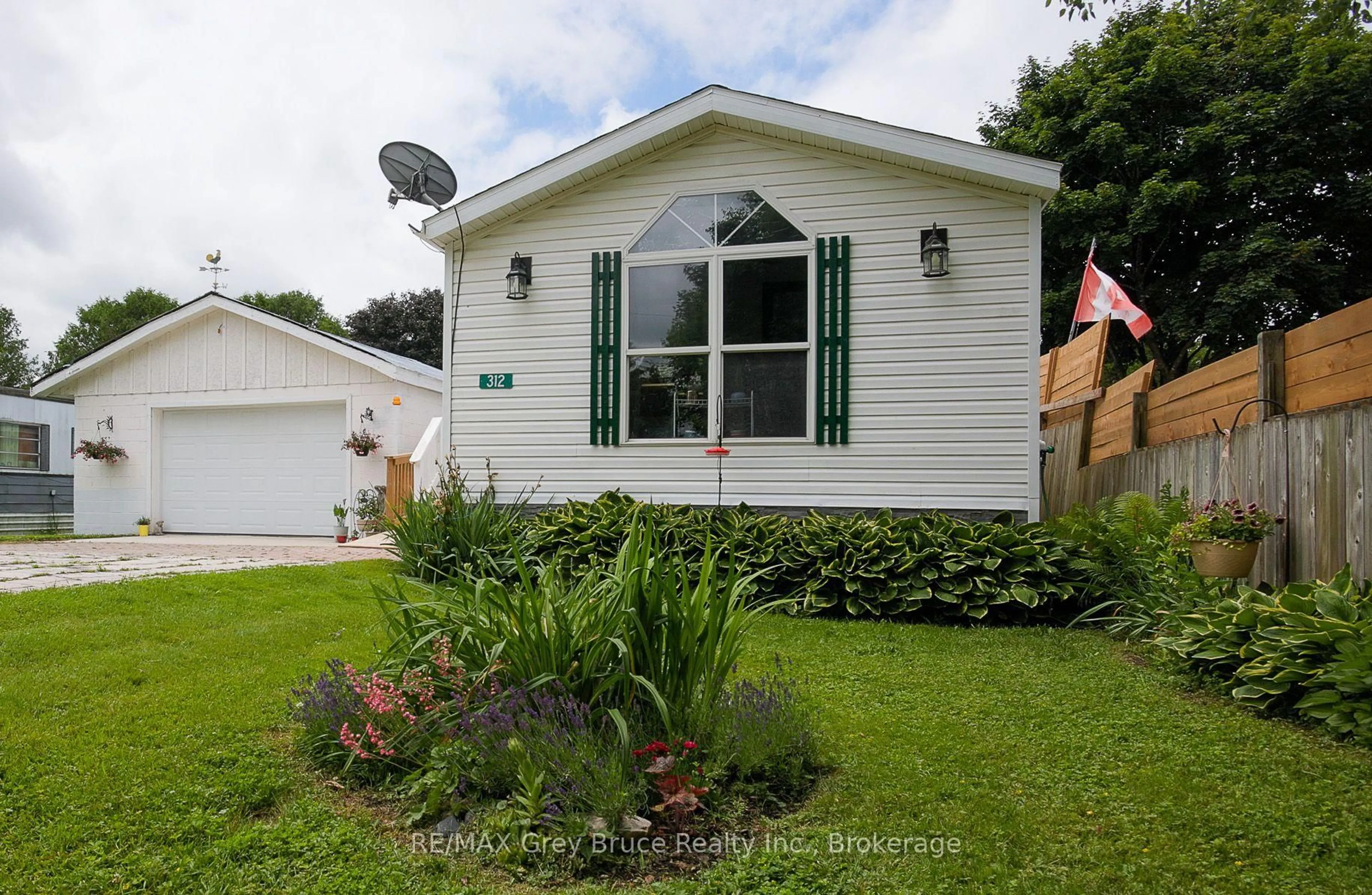 Home with vinyl exterior material, street for 312 Keady Park Lane, Georgian Bluffs Ontario N0H 2N0