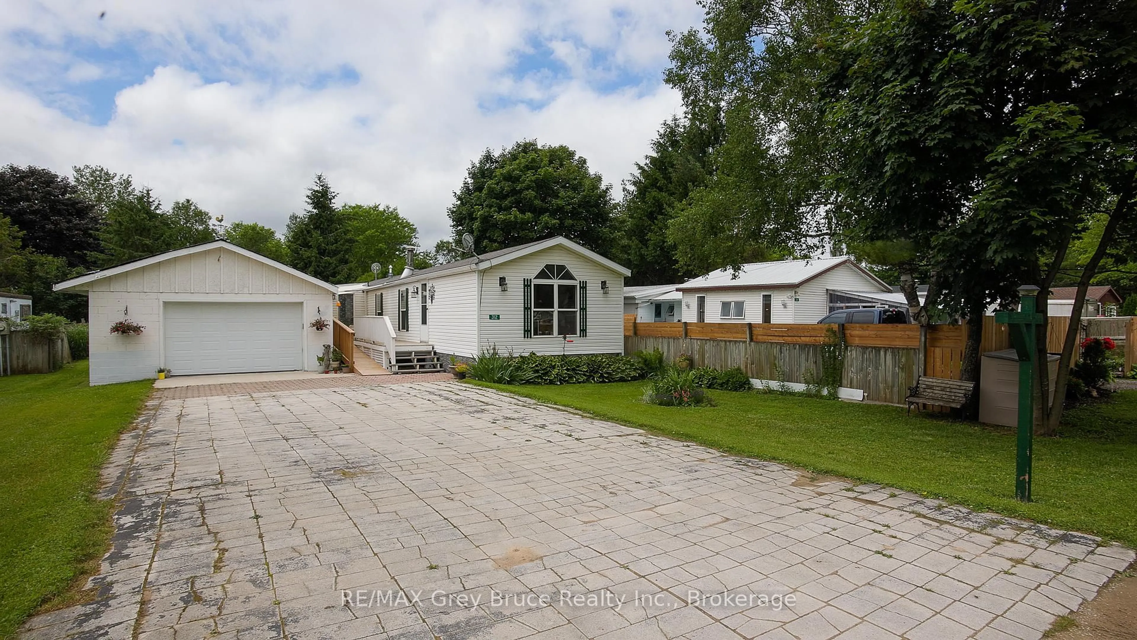 A pic from outside/outdoor area/front of a property/back of a property/a pic from drone, street for 312 Keady Park Lane, Georgian Bluffs Ontario N0H 2N0