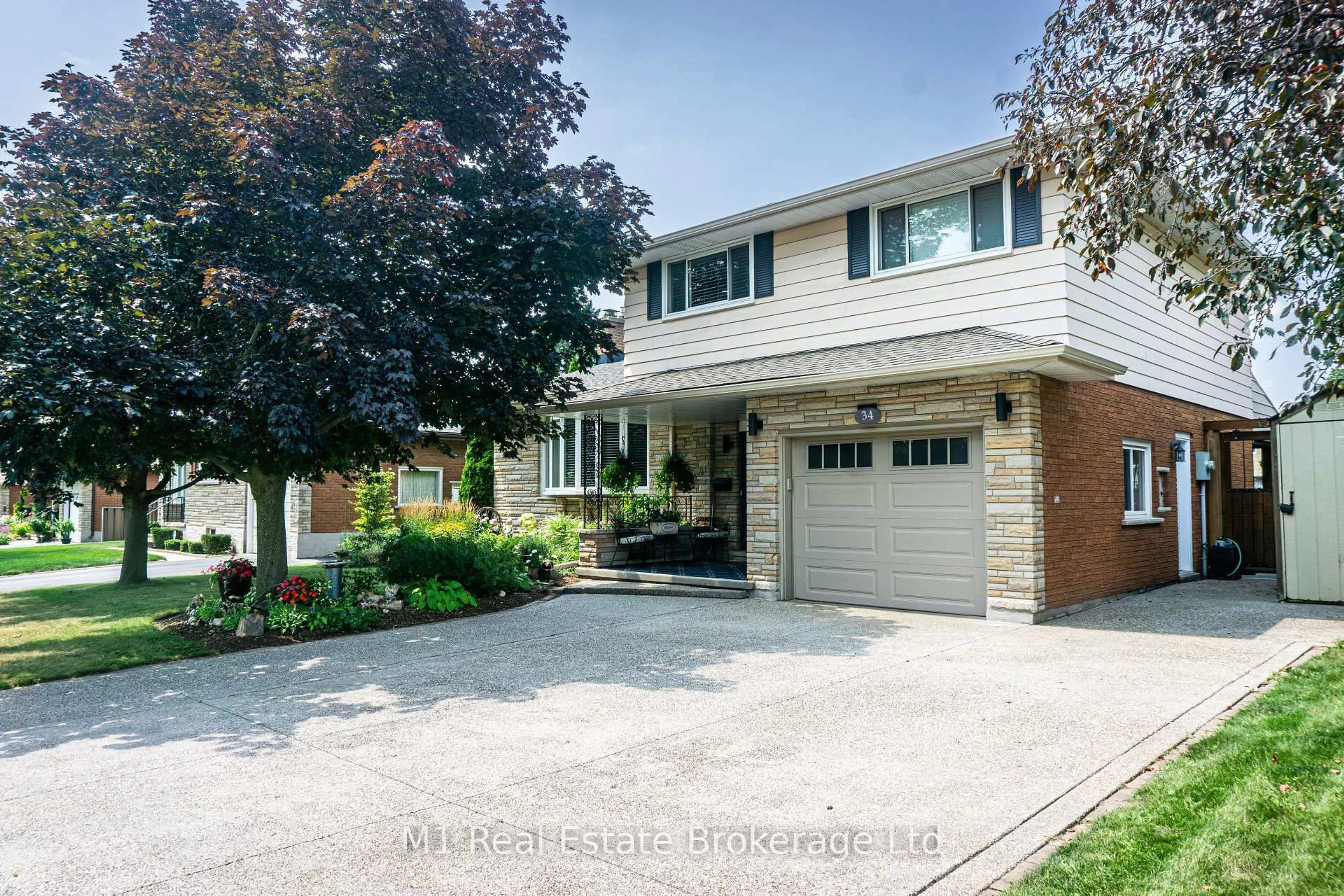 Home with brick exterior material, street for 34 Strathcona Cres, Kitchener Ontario N2B 2W6