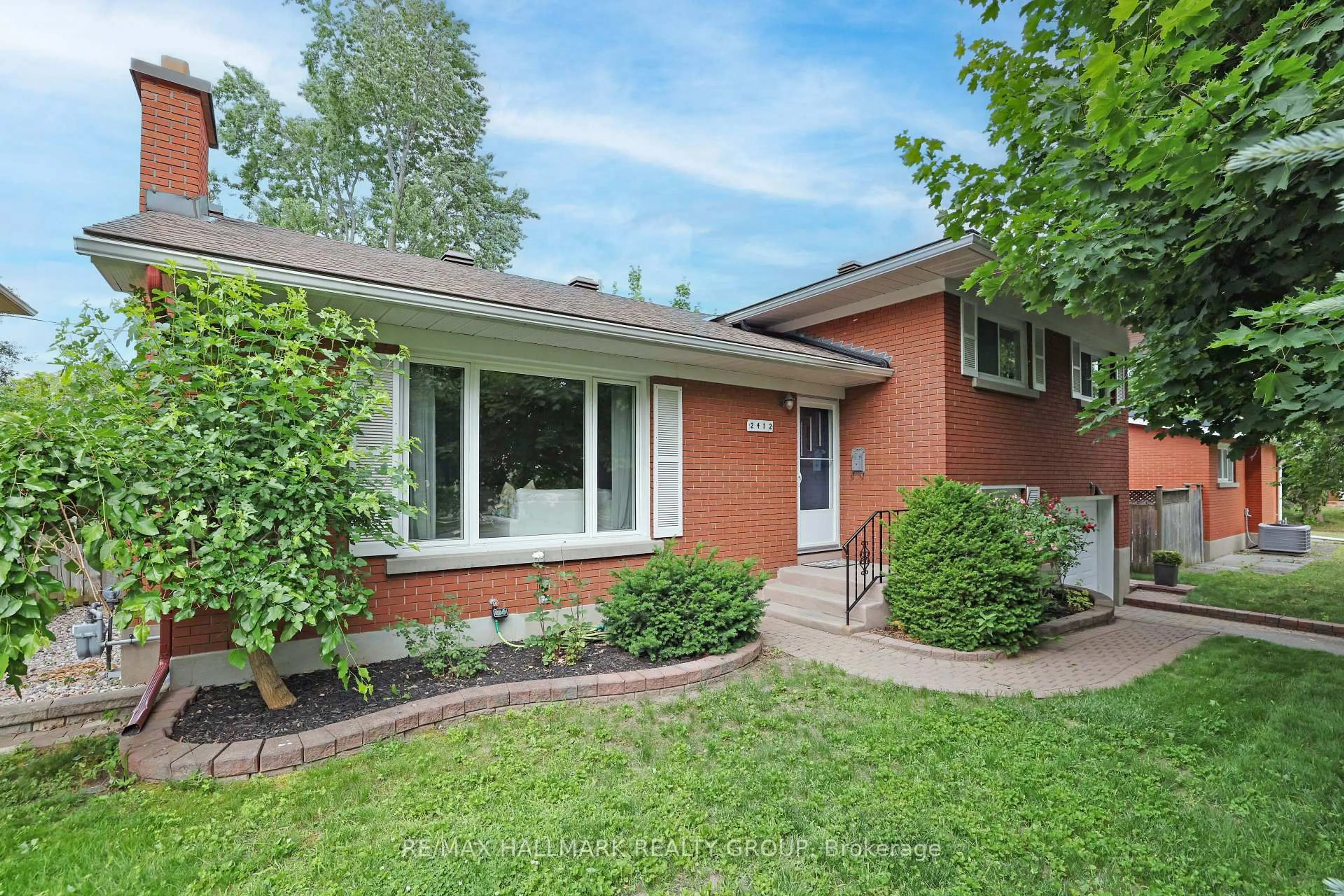 Home with brick exterior material, street for 2412 Malone Cres, Ottawa Ontario K2C 1L5