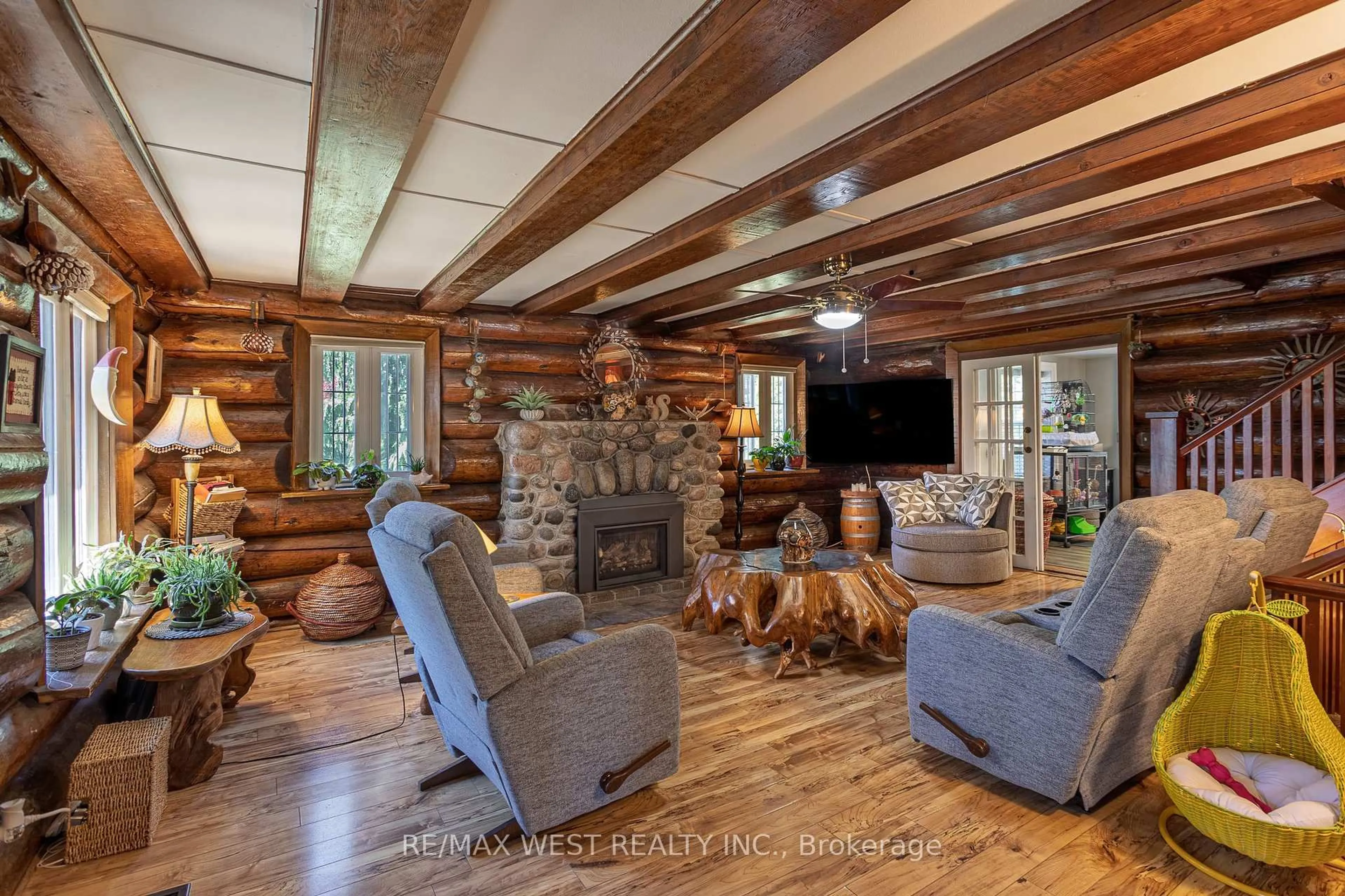 Living room with furniture, wood/laminate floor for 4504 County Rd #45, Cobourg Ontario K9A 4J9