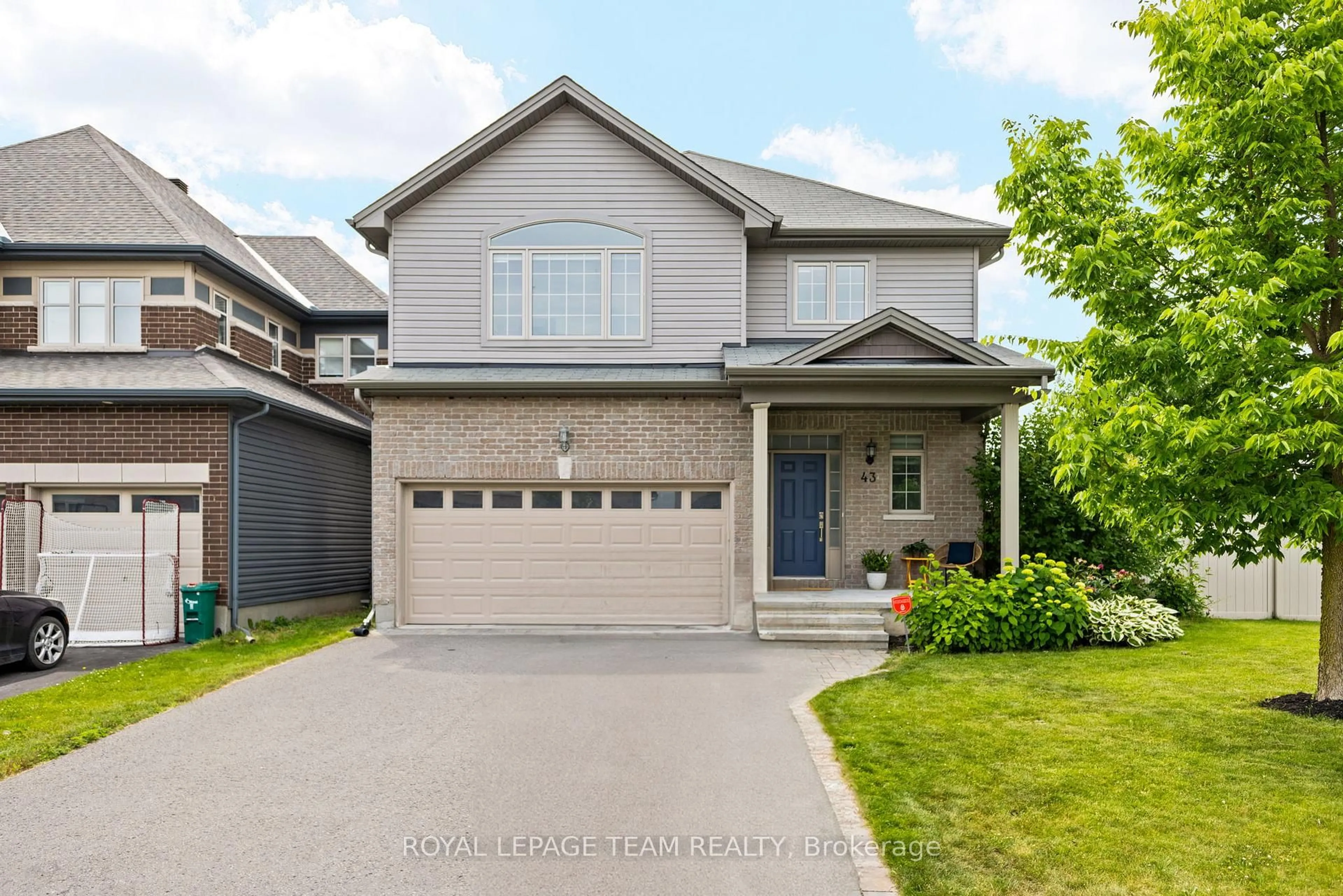 Home with vinyl exterior material, street for 43 Hibiscus Way, Ottawa Ontario K2J 6A5