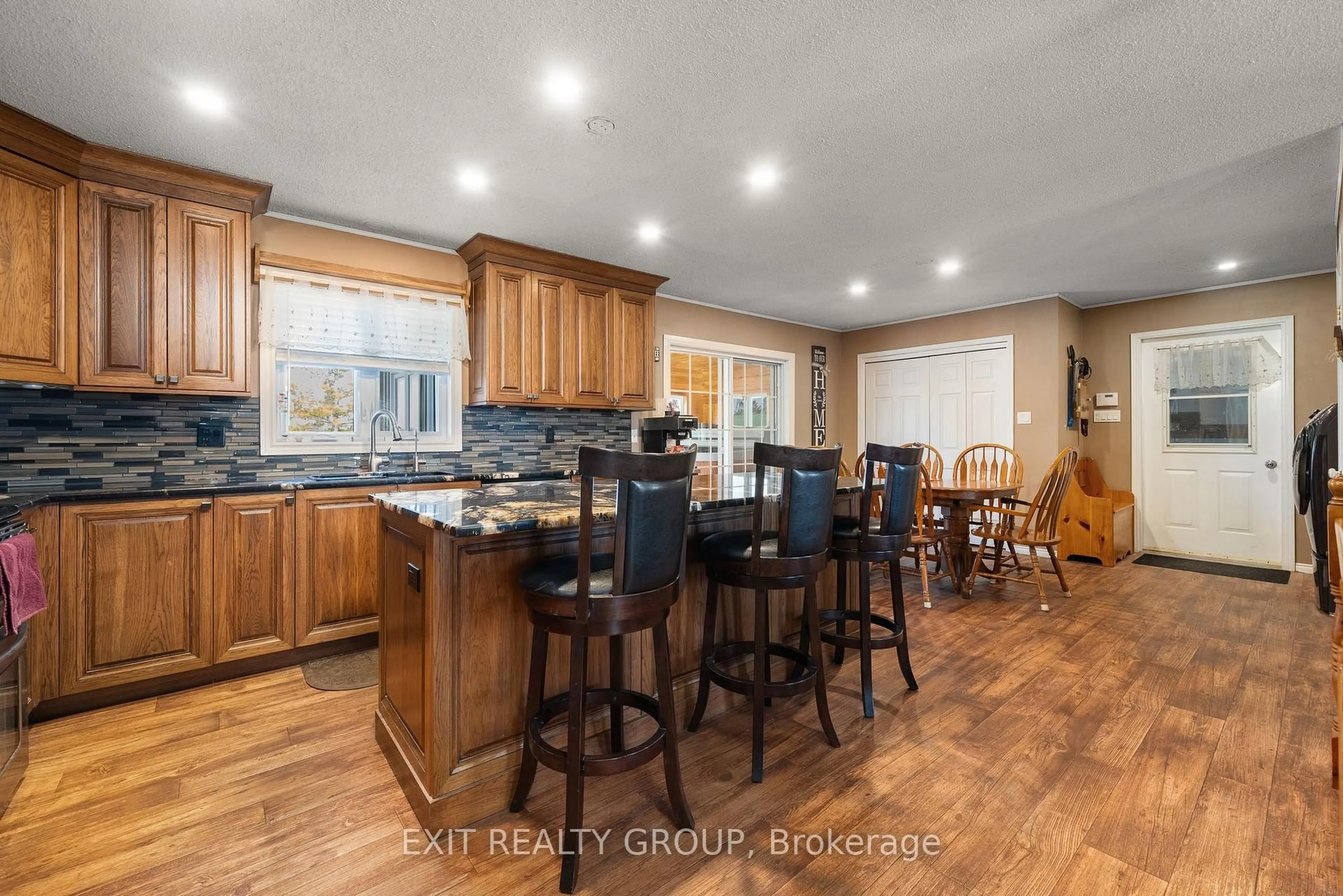 Open concept kitchen, wood/laminate floor for 325 County Rd 30, Prince Edward County Ontario K0K 1G0