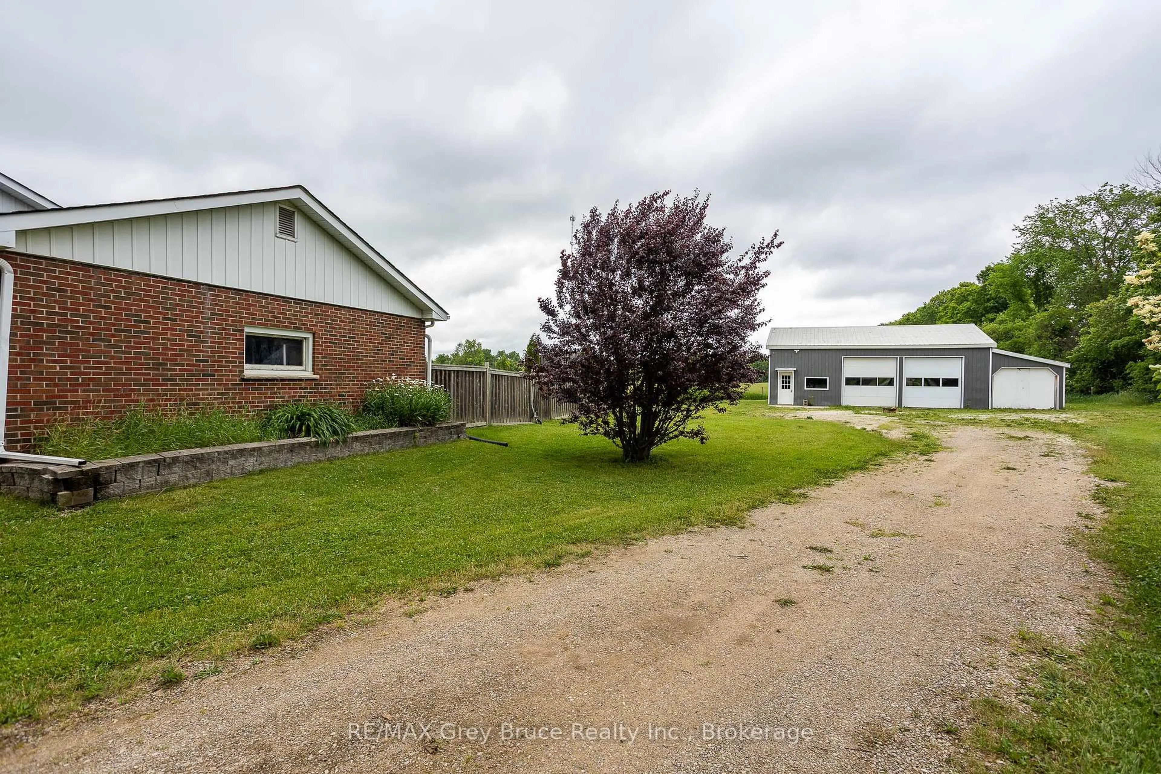 A pic from outside/outdoor area/front of a property/back of a property/a pic from drone, building for 718449 6 Highway, Georgian Bluffs Ontario N4K 5N7