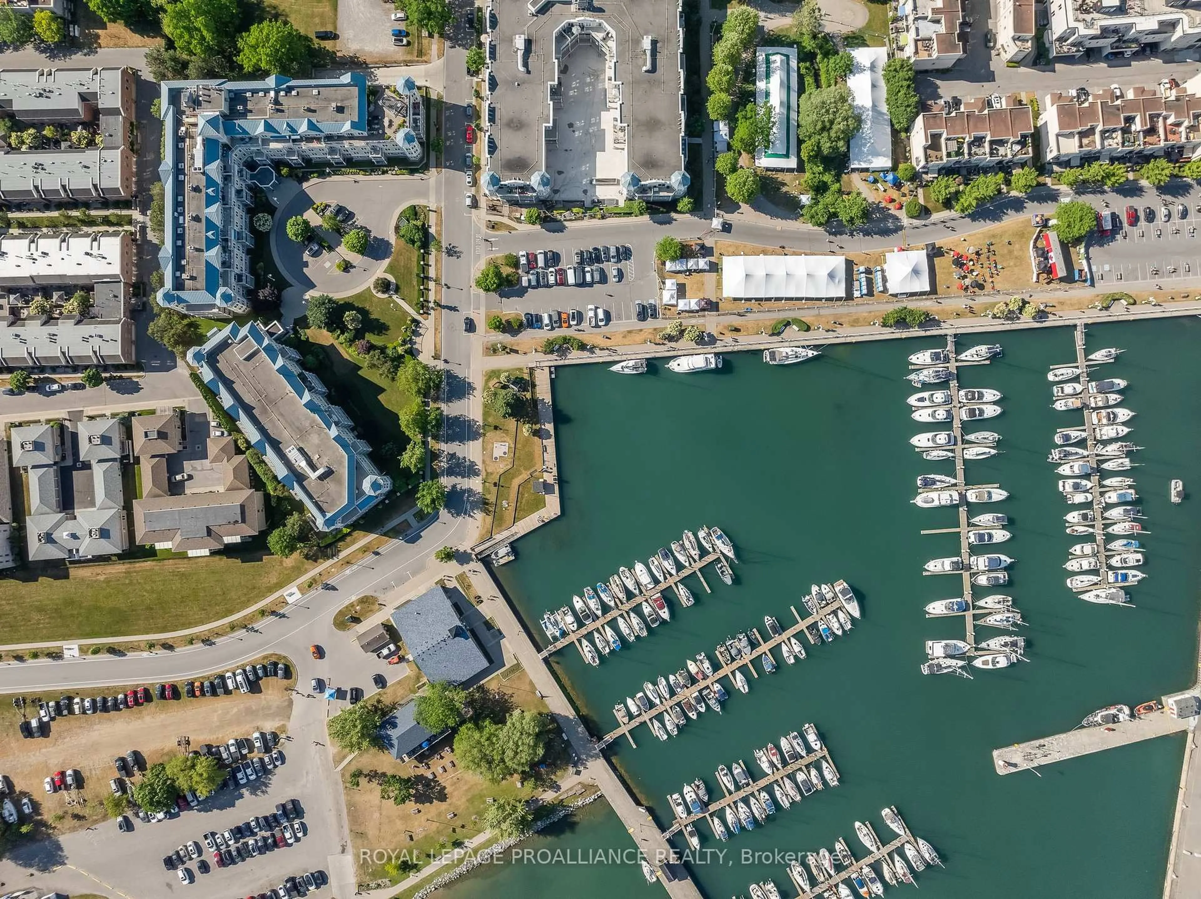 A pic from outside/outdoor area/front of a property/back of a property/a pic from drone, water/lake/river/ocean view for 125 Third St #407, Cobourg Ontario K9A 5W9