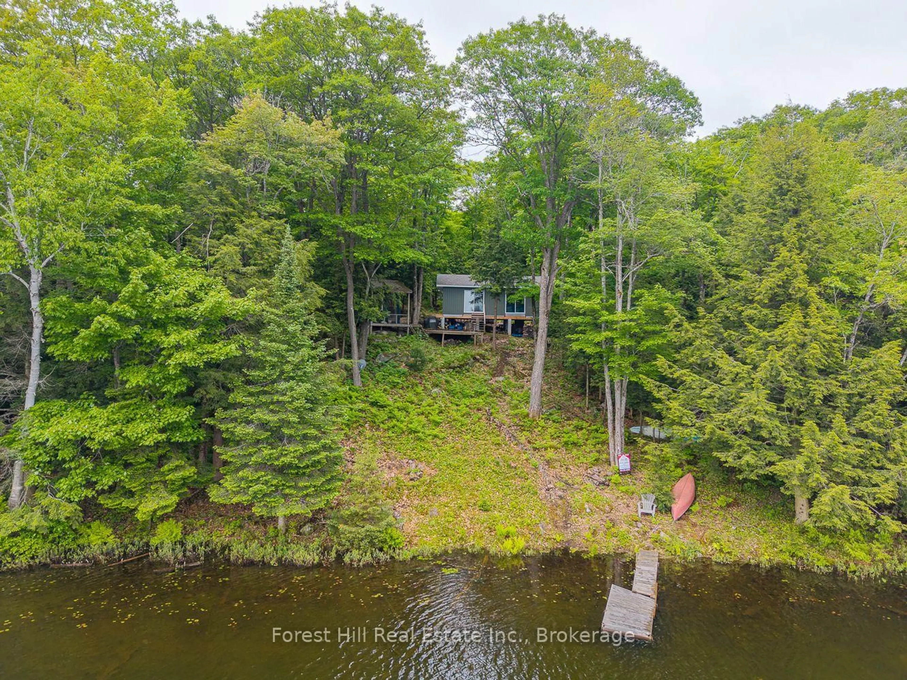 A pic from outside/outdoor area/front of a property/back of a property/a pic from drone, water/lake/river/ocean view for 60 Hawksview Lane, Seguin Ontario P2A 0B2