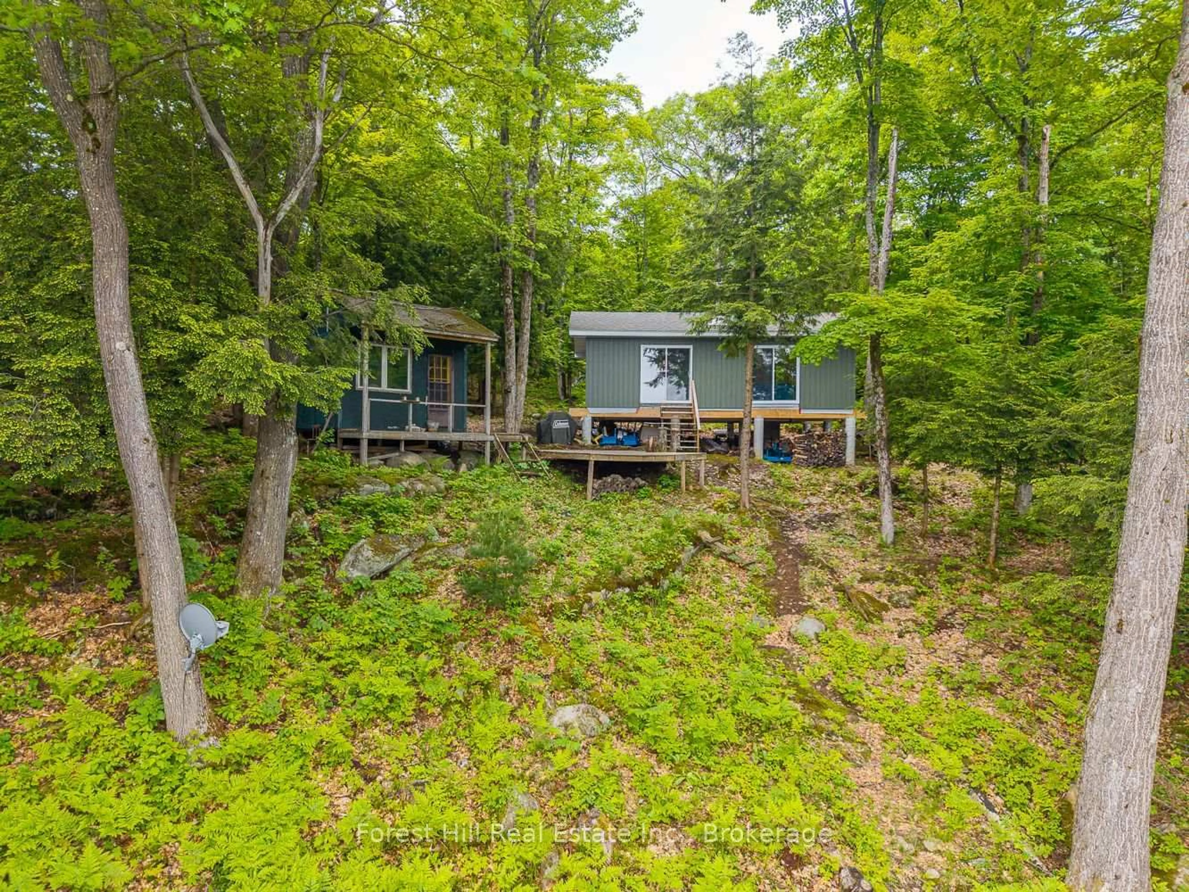 A pic from outside/outdoor area/front of a property/back of a property/a pic from drone, forest/trees view for 60 Hawksview Lane, Seguin Ontario P2A 0B2