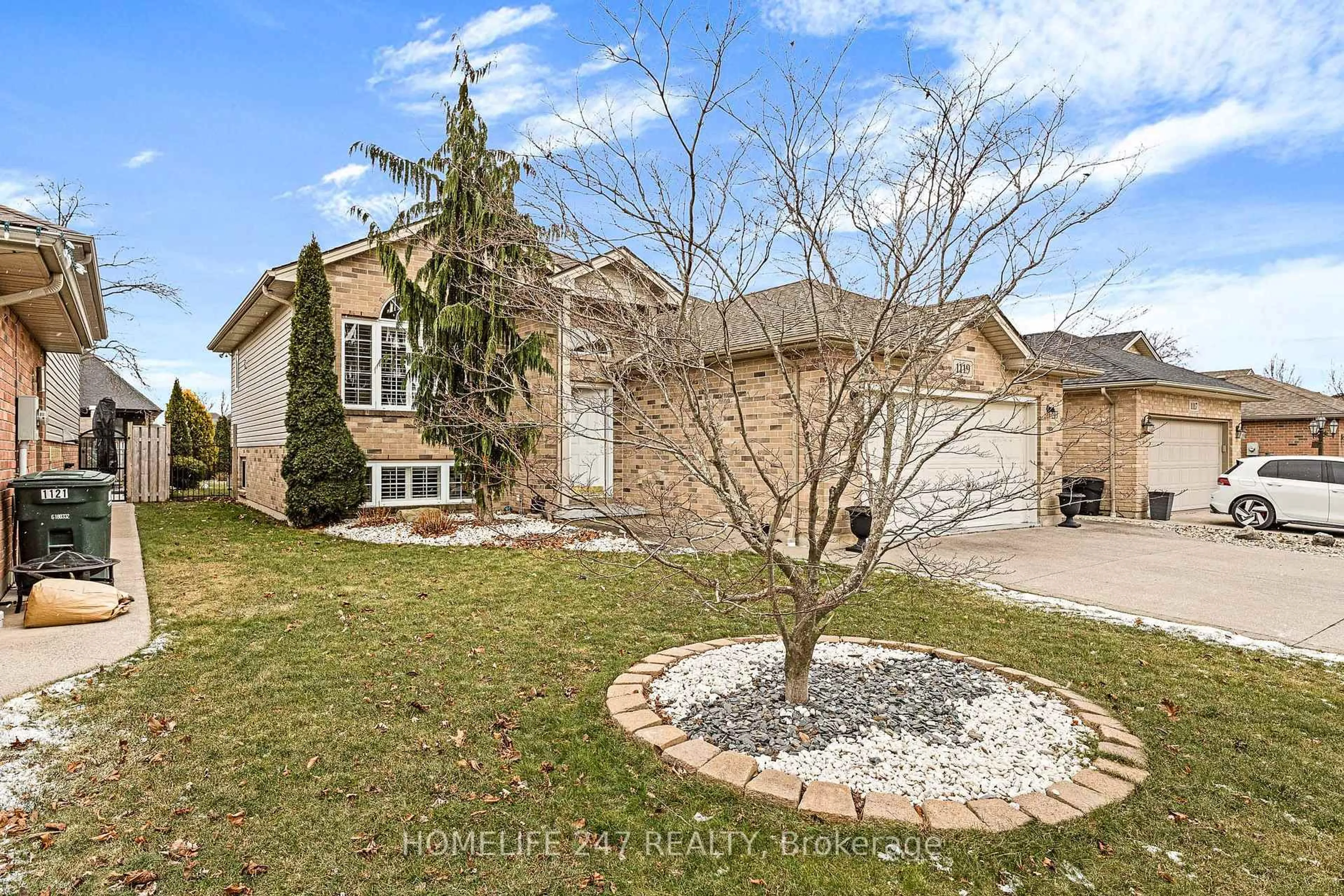Home with brick exterior material, street for 1119 Monarch Meadows Dr, Lakeshore Ontario N8L 0W5