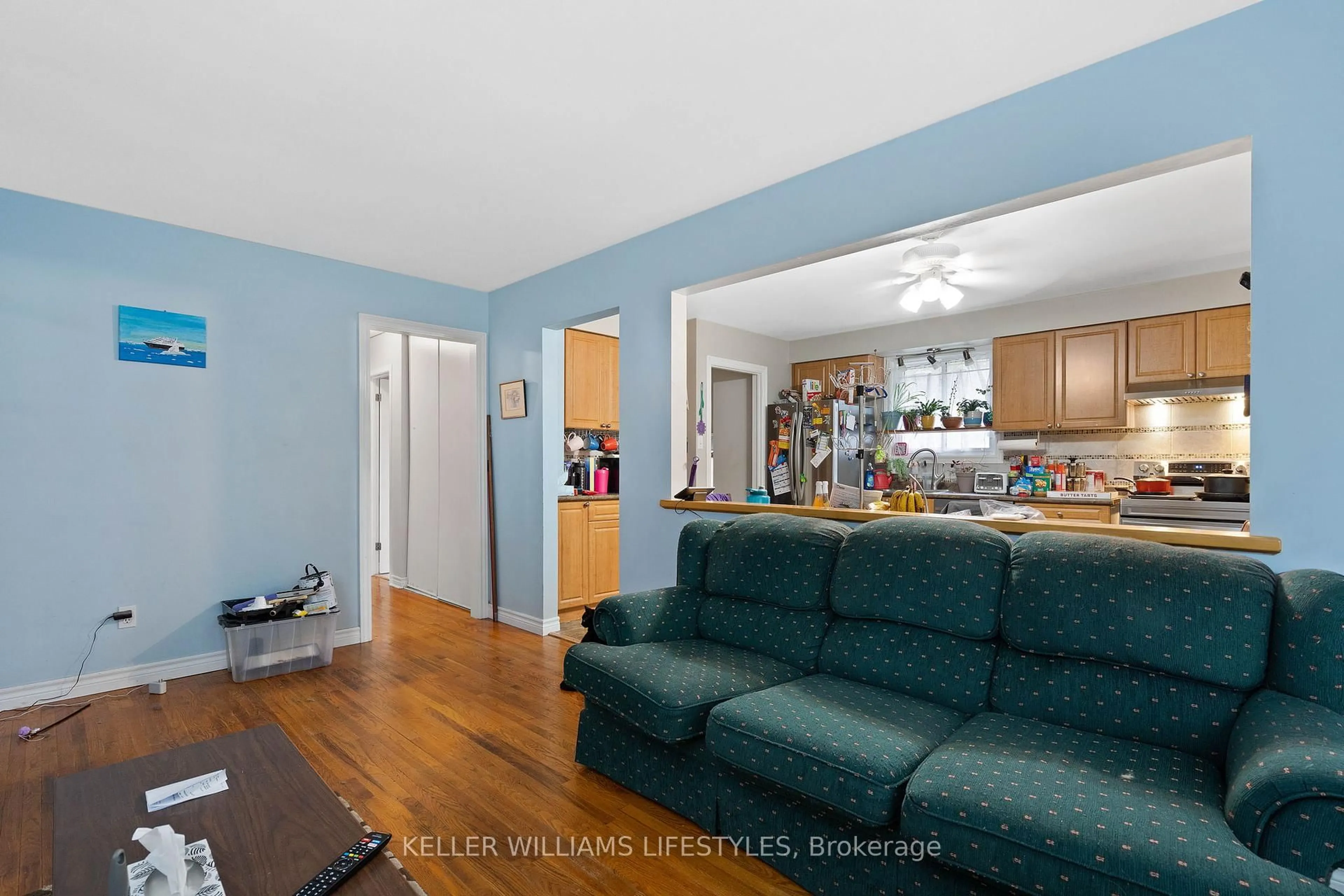 Living room with furniture, wood/laminate floor for 56 Stroud Cres, London South Ontario N6E 1Z6
