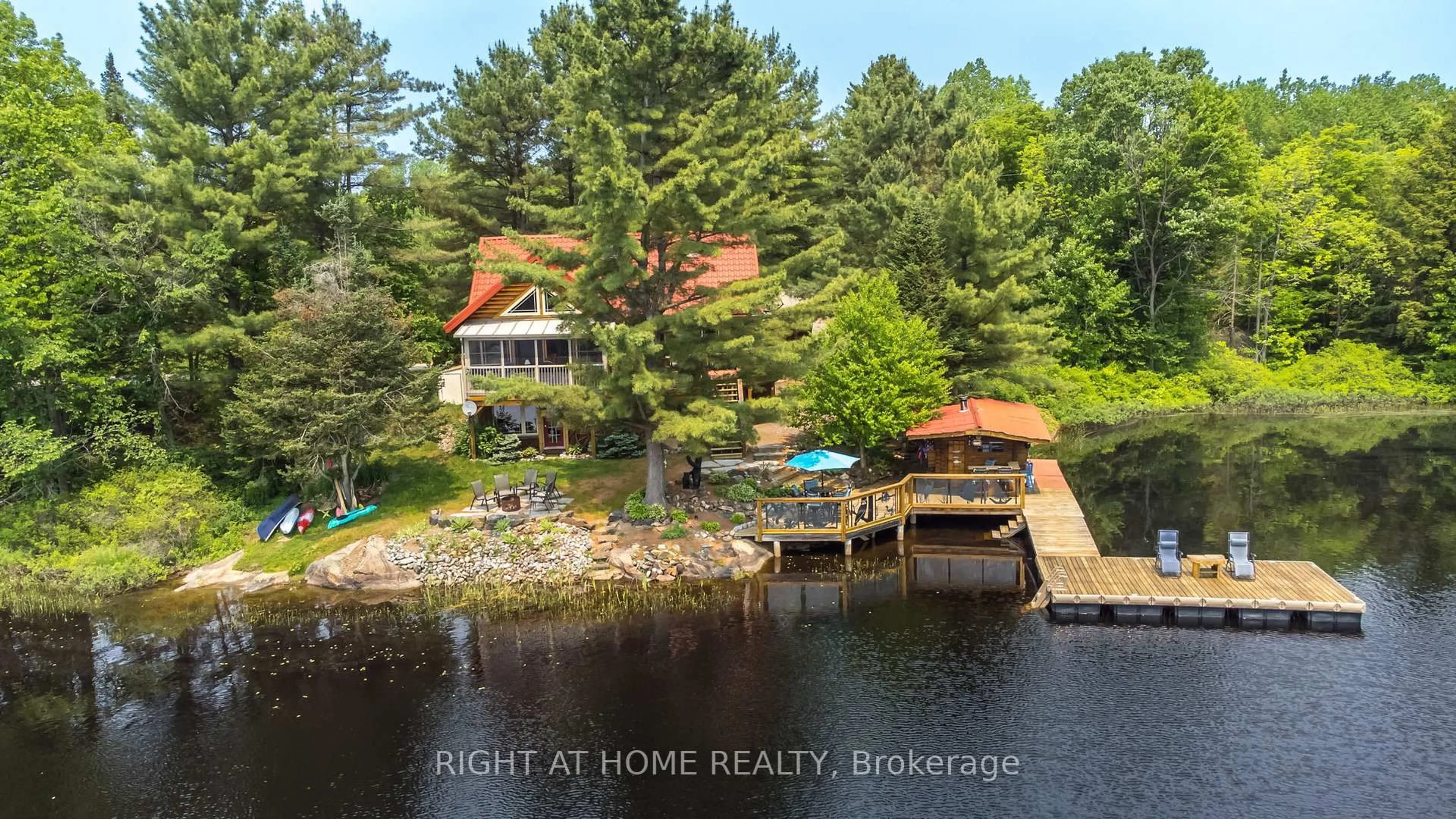 A pic from outside/outdoor area/front of a property/back of a property/a pic from drone, water/lake/river/ocean view for 235 LOCH ERNE Rd, McDougall Ontario P2A 2W7