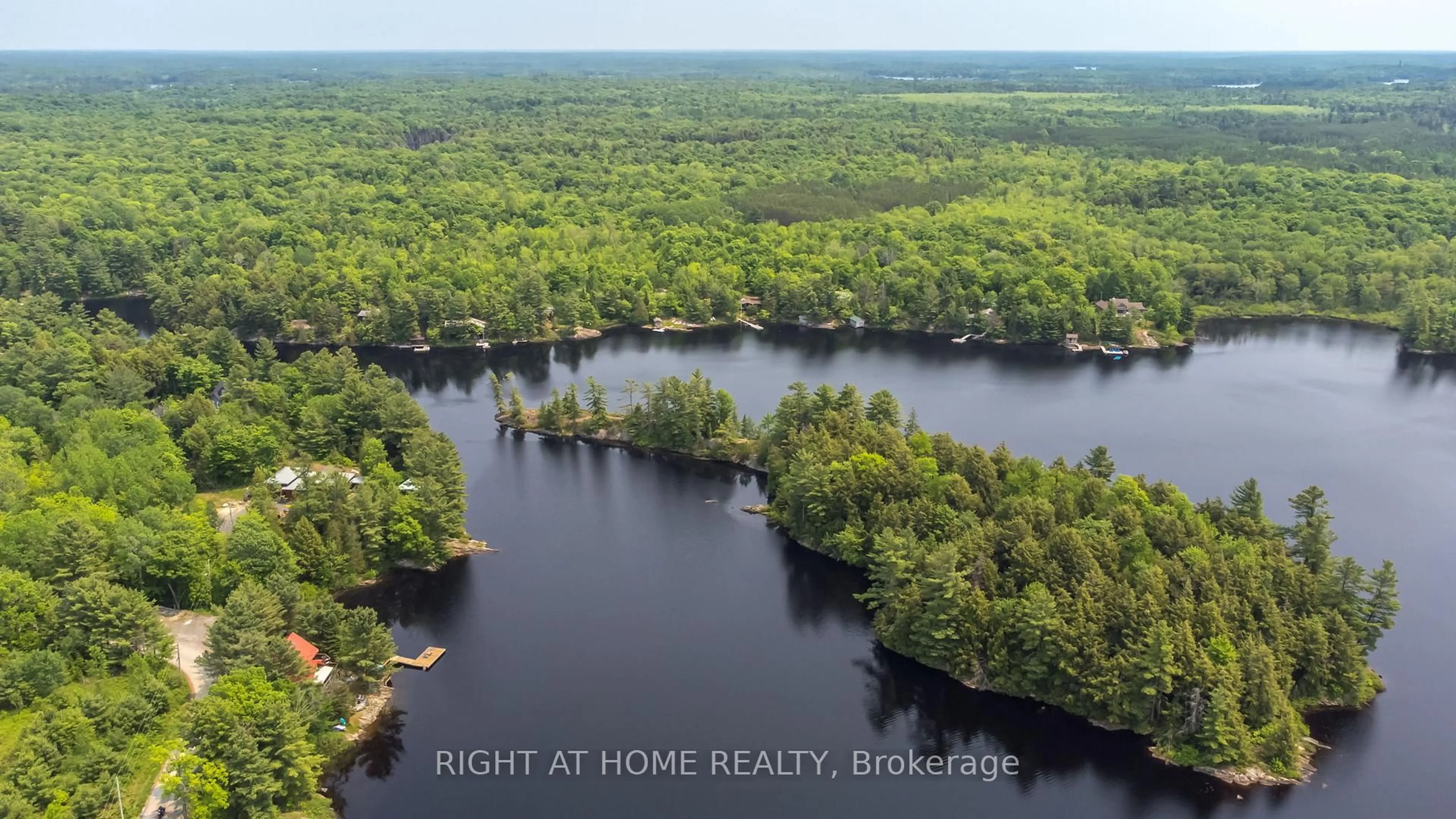 A pic from outside/outdoor area/front of a property/back of a property/a pic from drone, water/lake/river/ocean view for 235 LOCH ERNE Rd, McDougall Ontario P2A 2W7