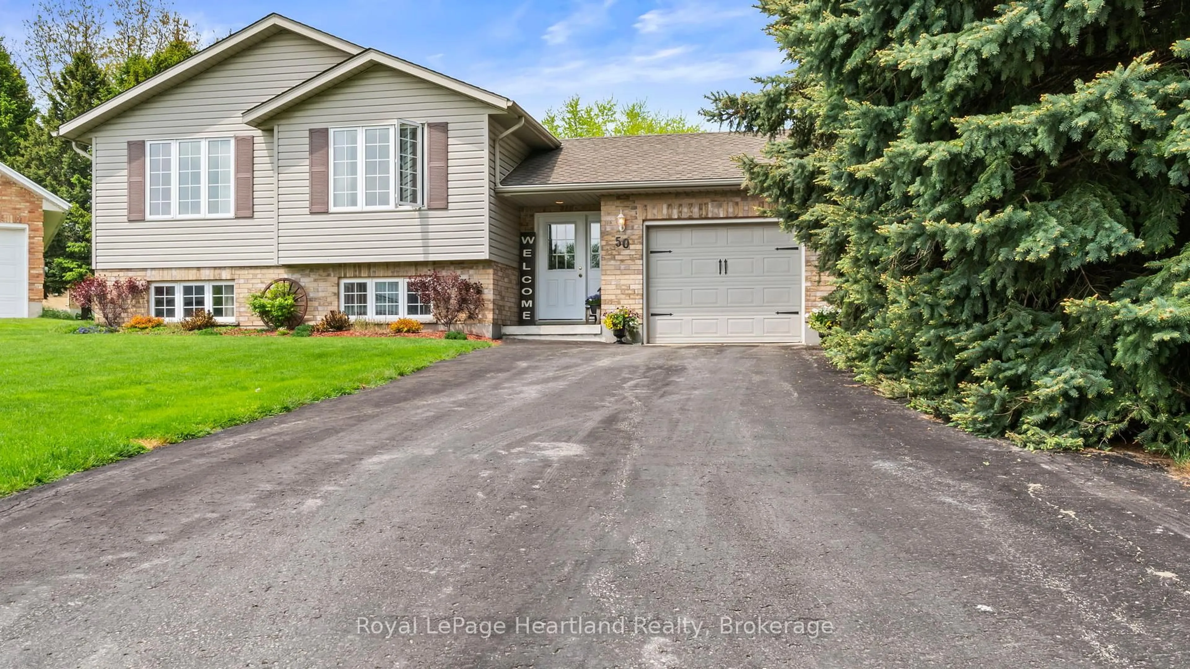 Home with vinyl exterior material, street for 50 MCDONALD Dr, Huron East Ontario N0G 1H0