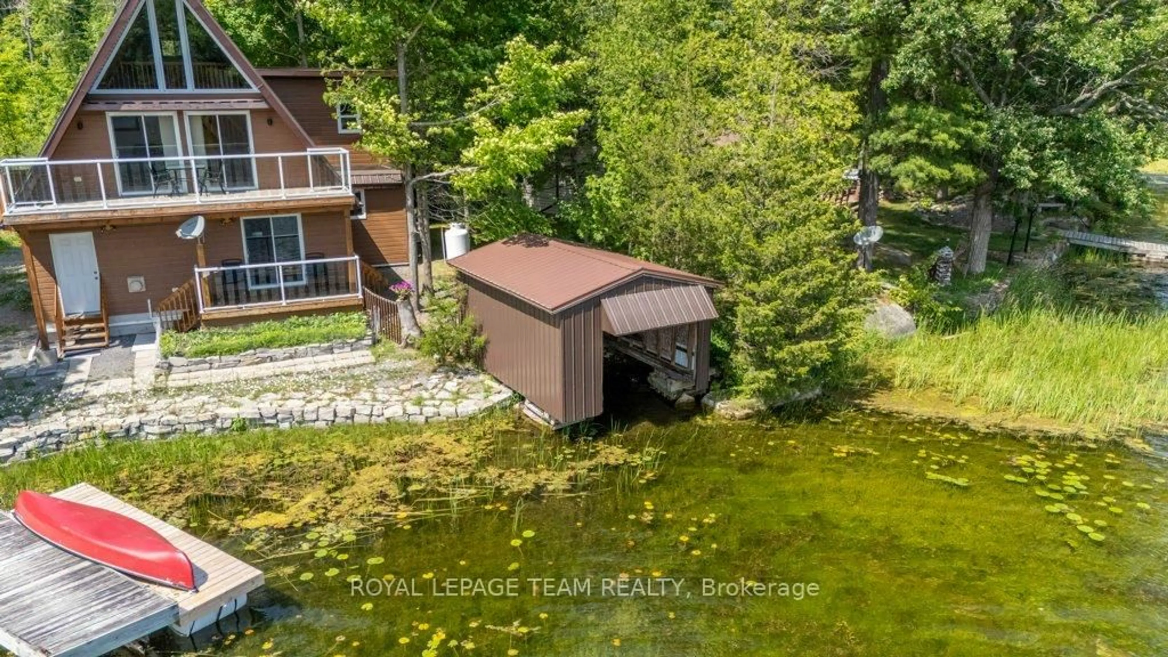 A pic from outside/outdoor area/front of a property/back of a property/a pic from drone, water/lake/river/ocean view for 304 Hay Bay Lane, Leeds and the Thousand Islands Ontario K0E 1L0