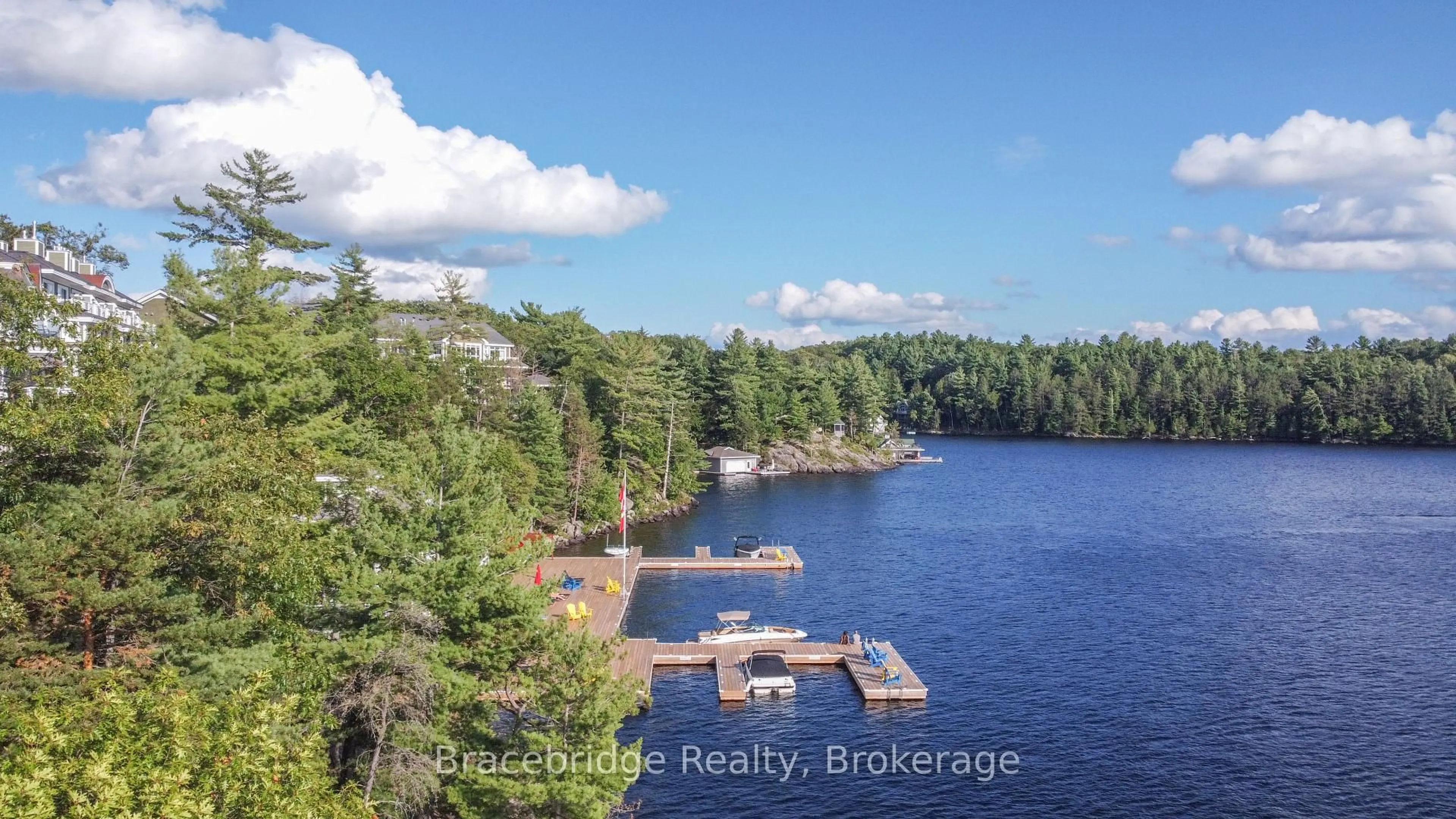 A pic from outside/outdoor area/front of a property/back of a property/a pic from drone, water/lake/river/ocean view for 1869 Muskoka 118 Rd #A102-A1&A2, Muskoka Lakes Ontario P1L 1W8