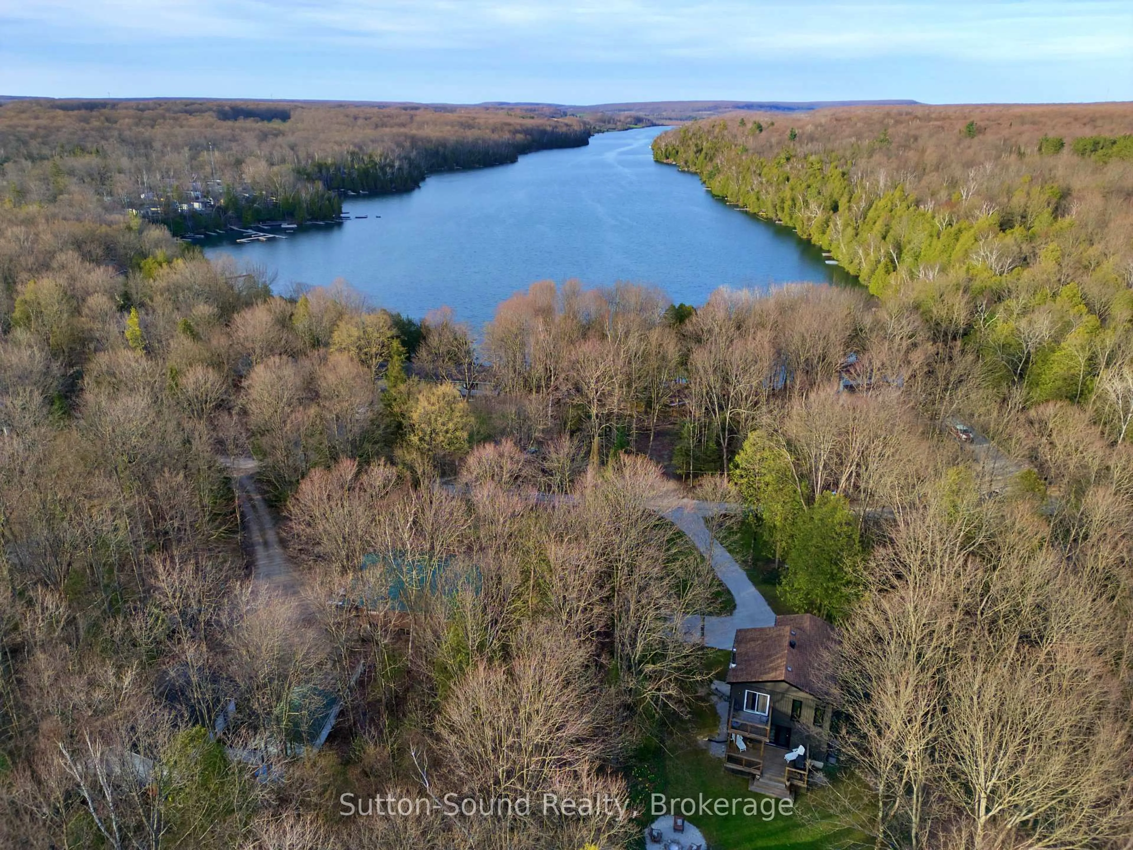 A pic from outside/outdoor area/front of a property/back of a property/a pic from drone, water/lake/river/ocean view for 134 Lakeview Dr, Georgian Bluffs Ontario N0H 2T0