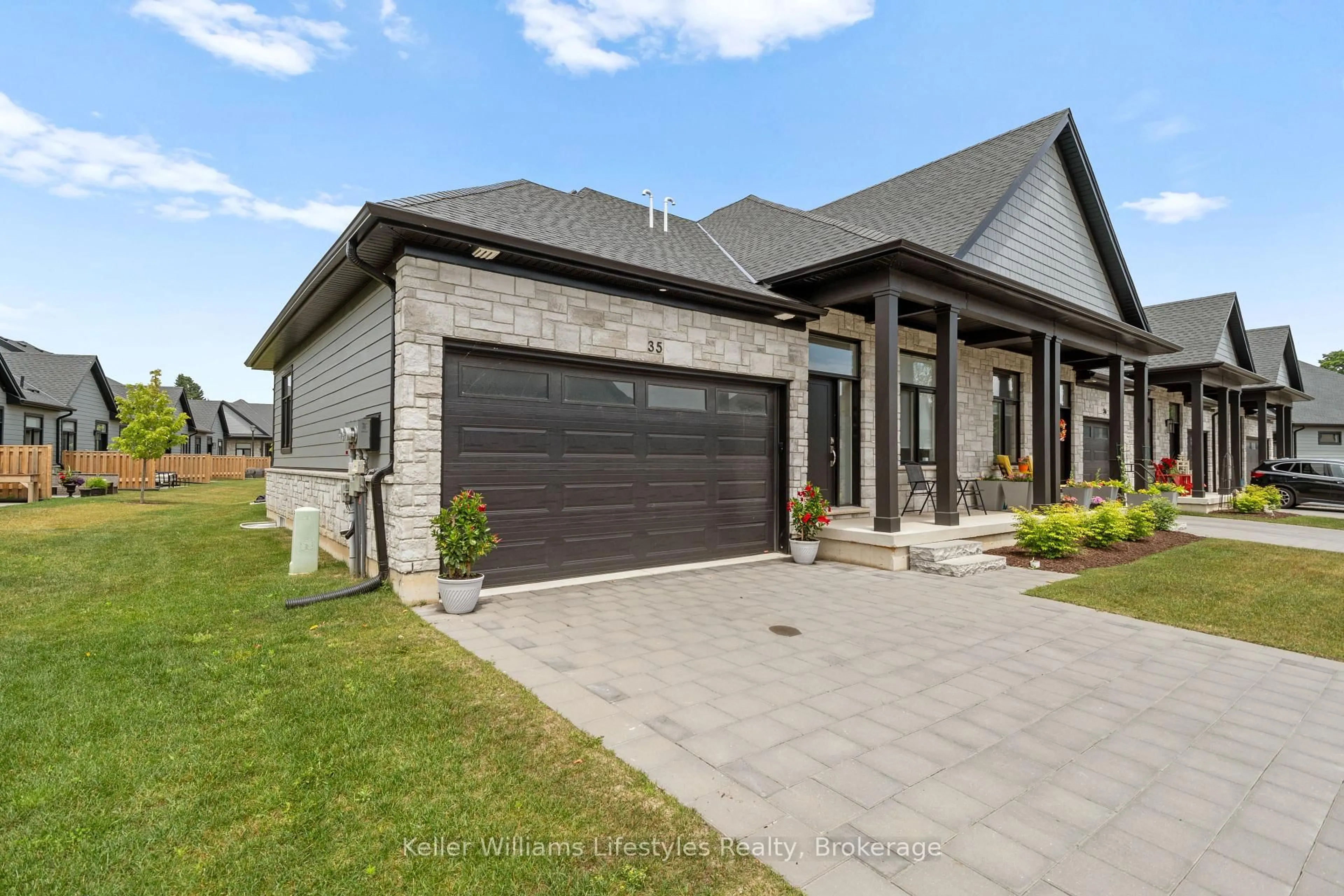 Home with brick exterior material, street for 63 Compass Tr #35, Central Elgin Ontario N5L 0B4