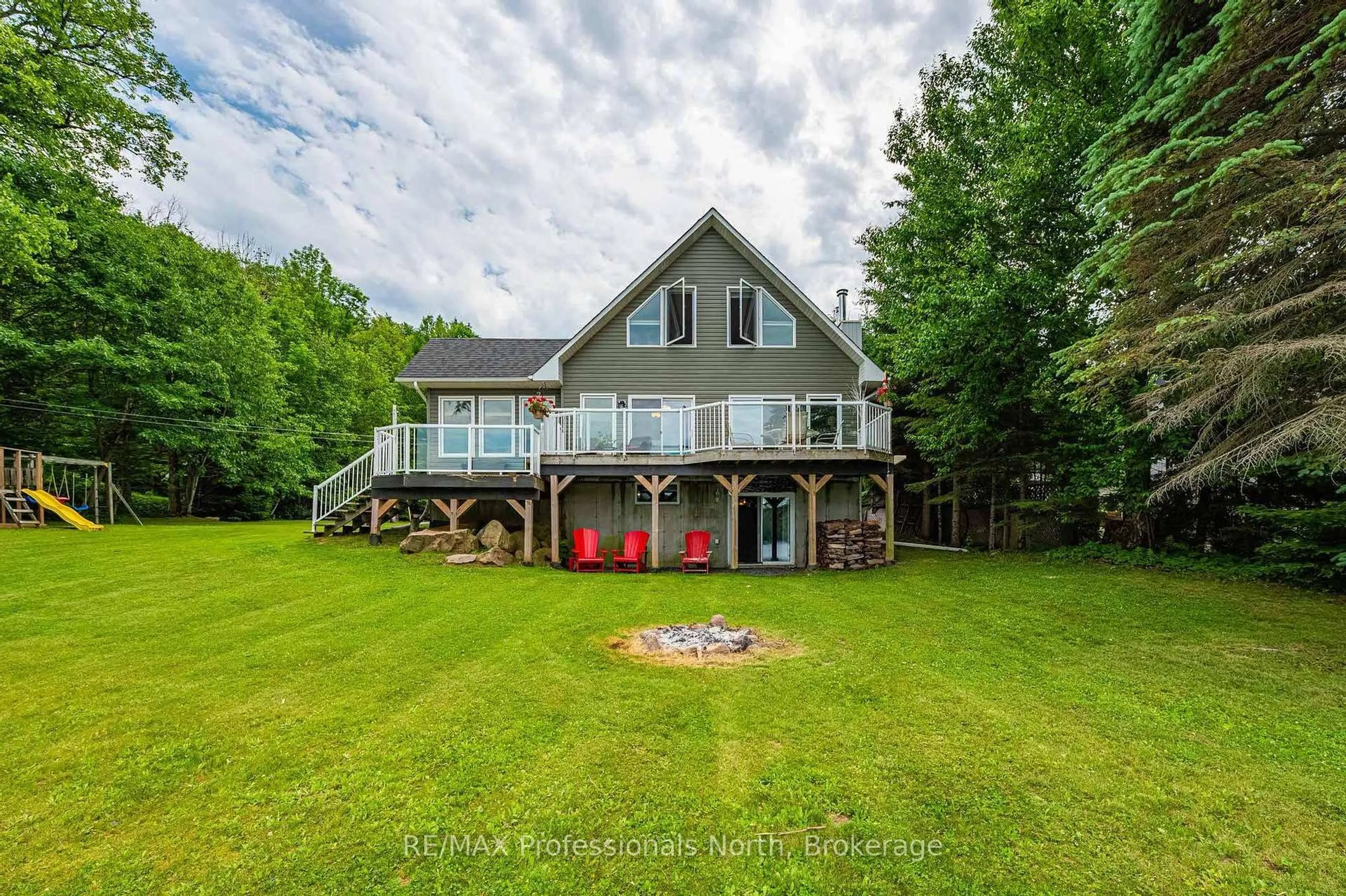 A pic from outside/outdoor area/front of a property/back of a property/a pic from drone, water/lake/river/ocean view for 1075 Comak Cres, Algonquin Highlands Ontario K0M 1S0