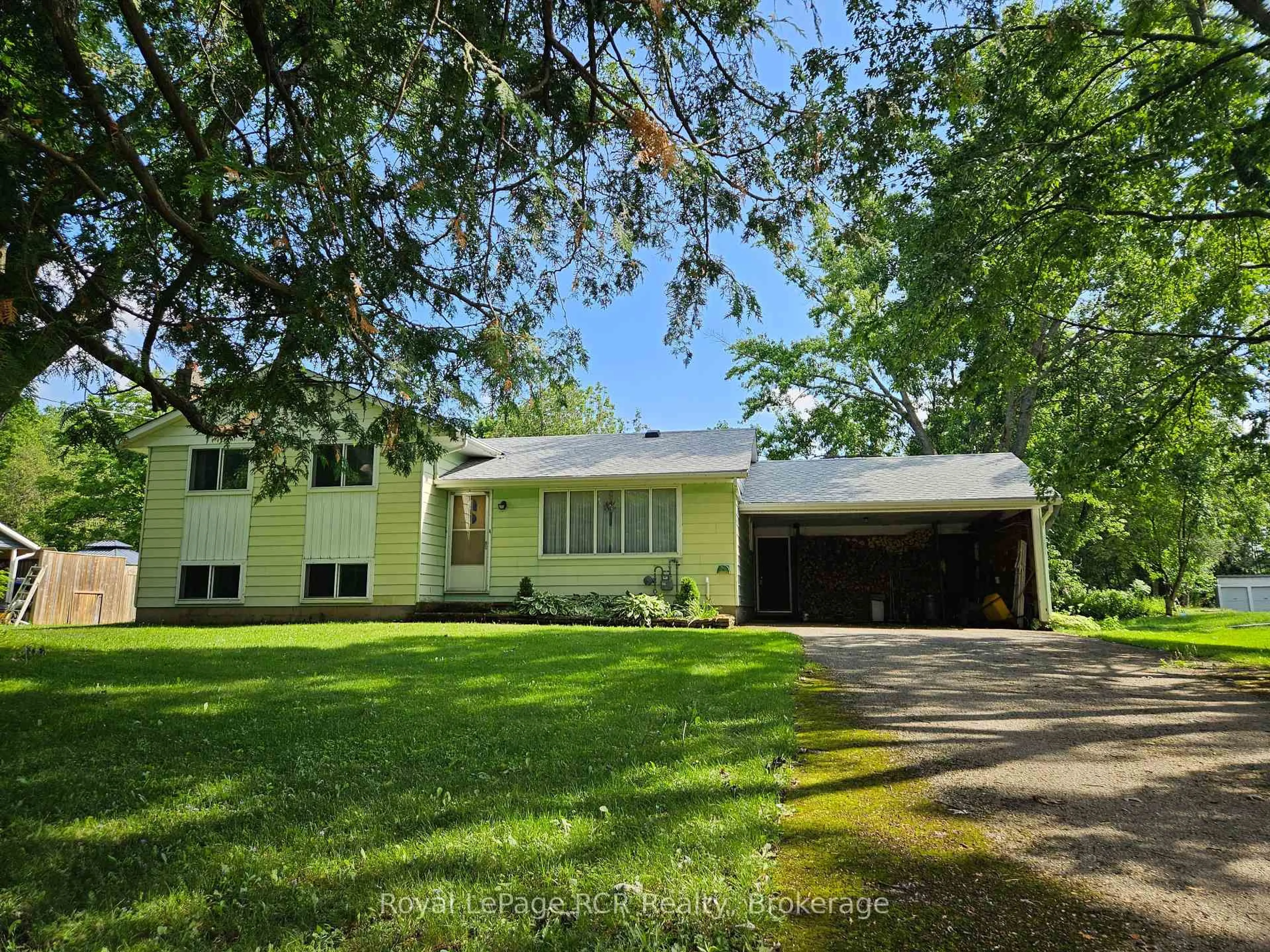 A pic from outside/outdoor area/front of a property/back of a property/a pic from drone, street for 303482 Indian Acres Rd, Georgian Bluffs Ontario N4K 0G3