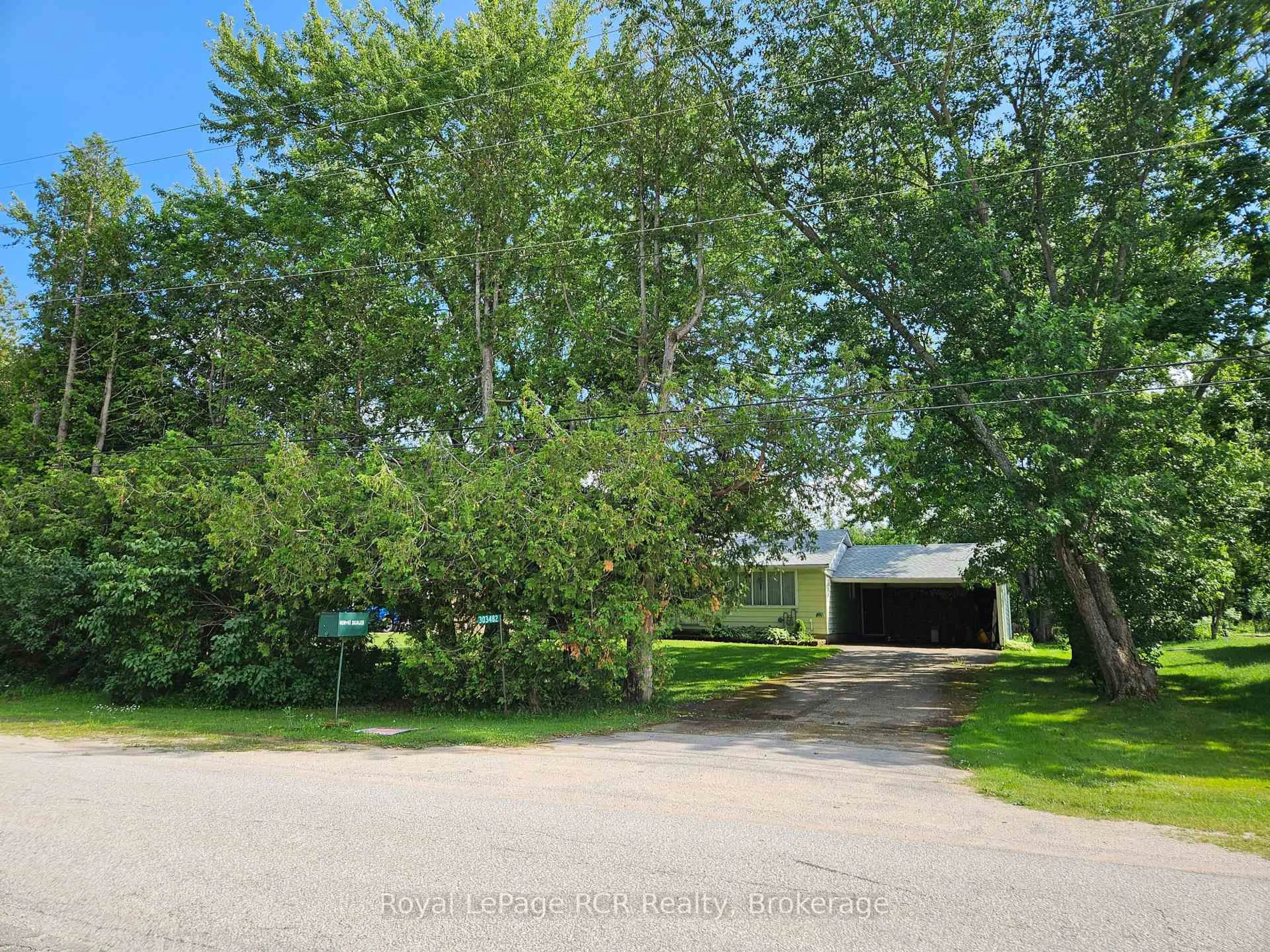 A pic from outside/outdoor area/front of a property/back of a property/a pic from drone, street for 303482 Indian Acres Rd, Georgian Bluffs Ontario N4K 0G3