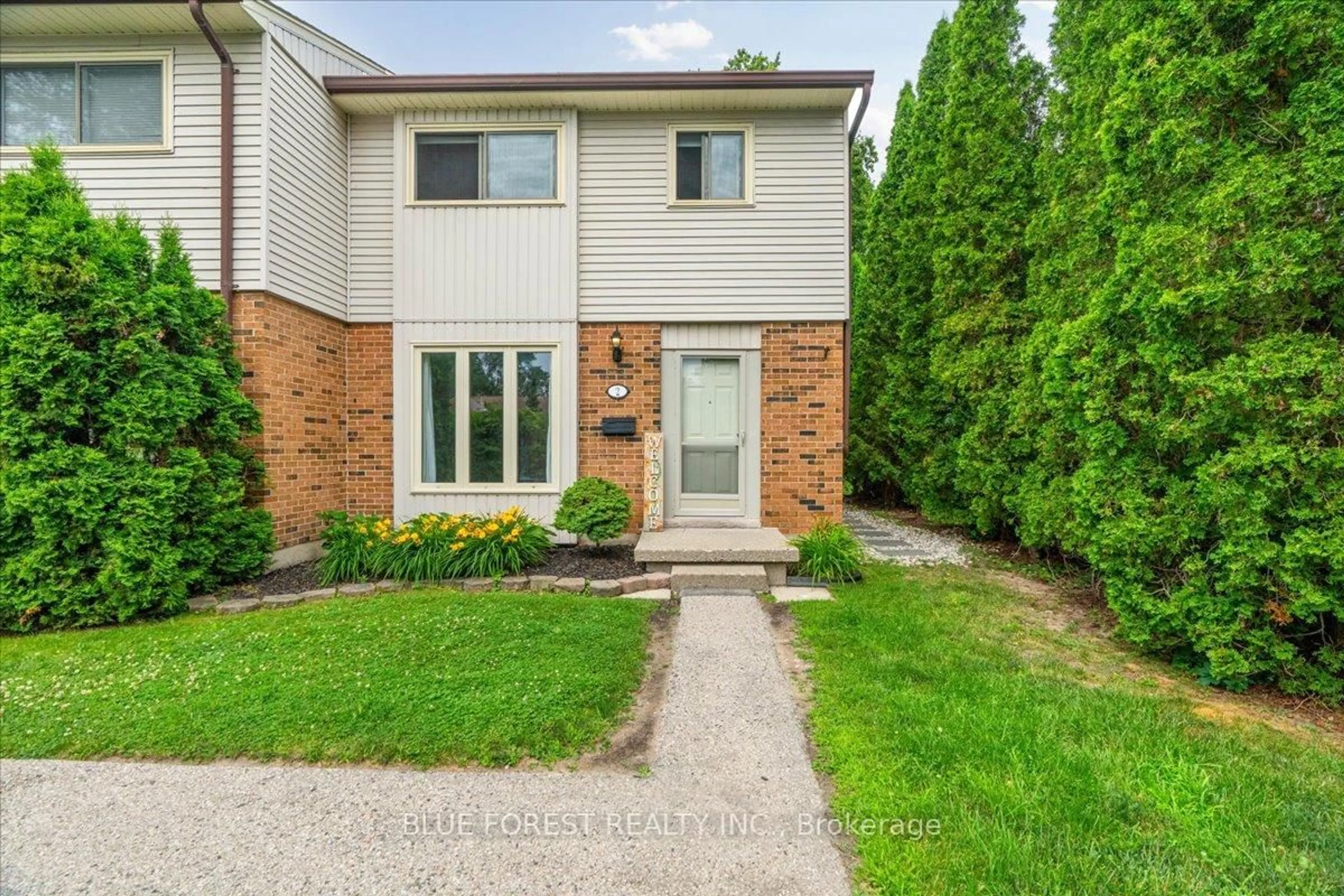 Home with brick exterior material, street for 1328 Commissioners Rd #2, London South Ontario N6K 2Y6