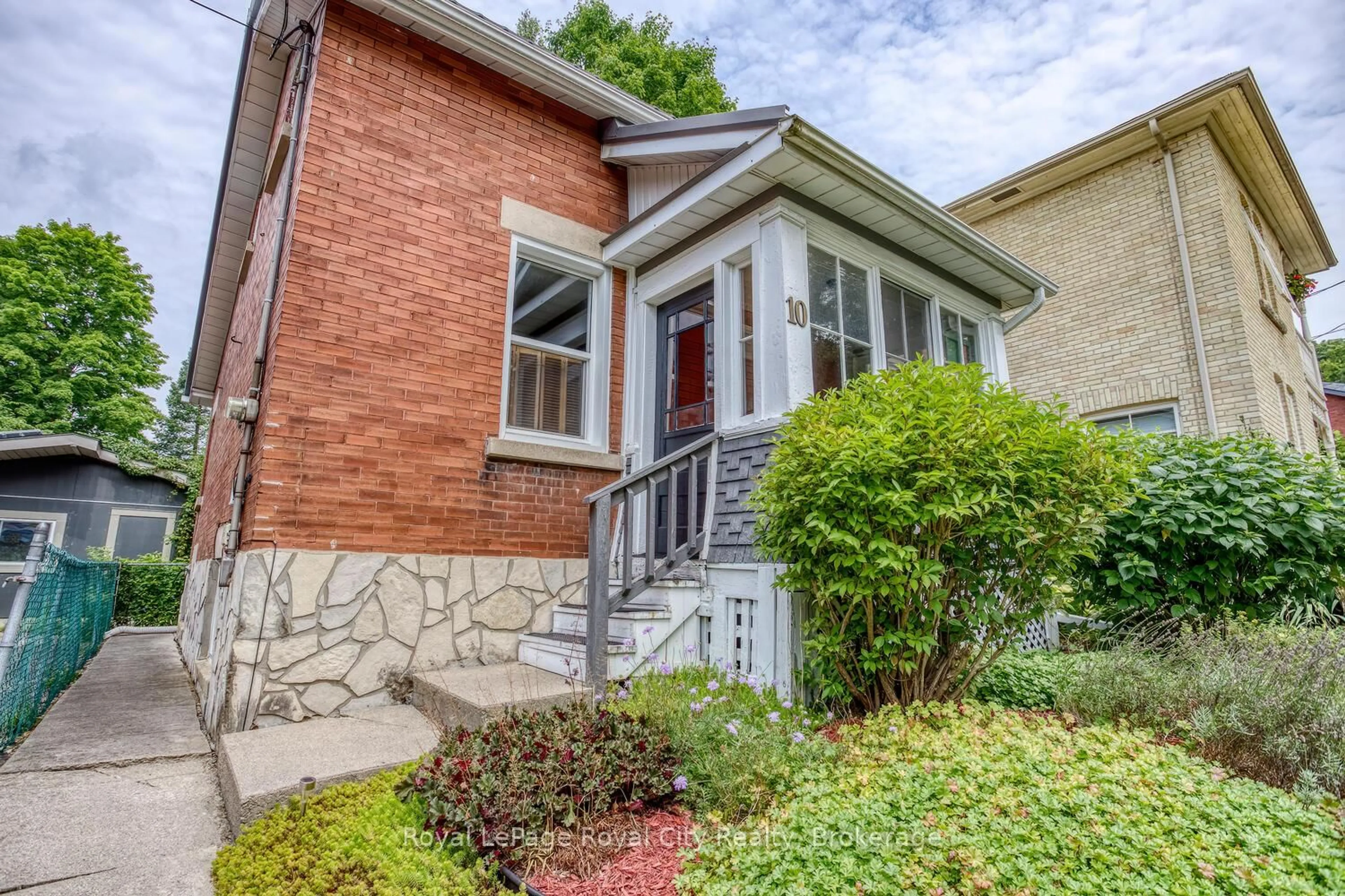 Home with brick exterior material, street for 10 Pearl St, Guelph Ontario N1E 2E3
