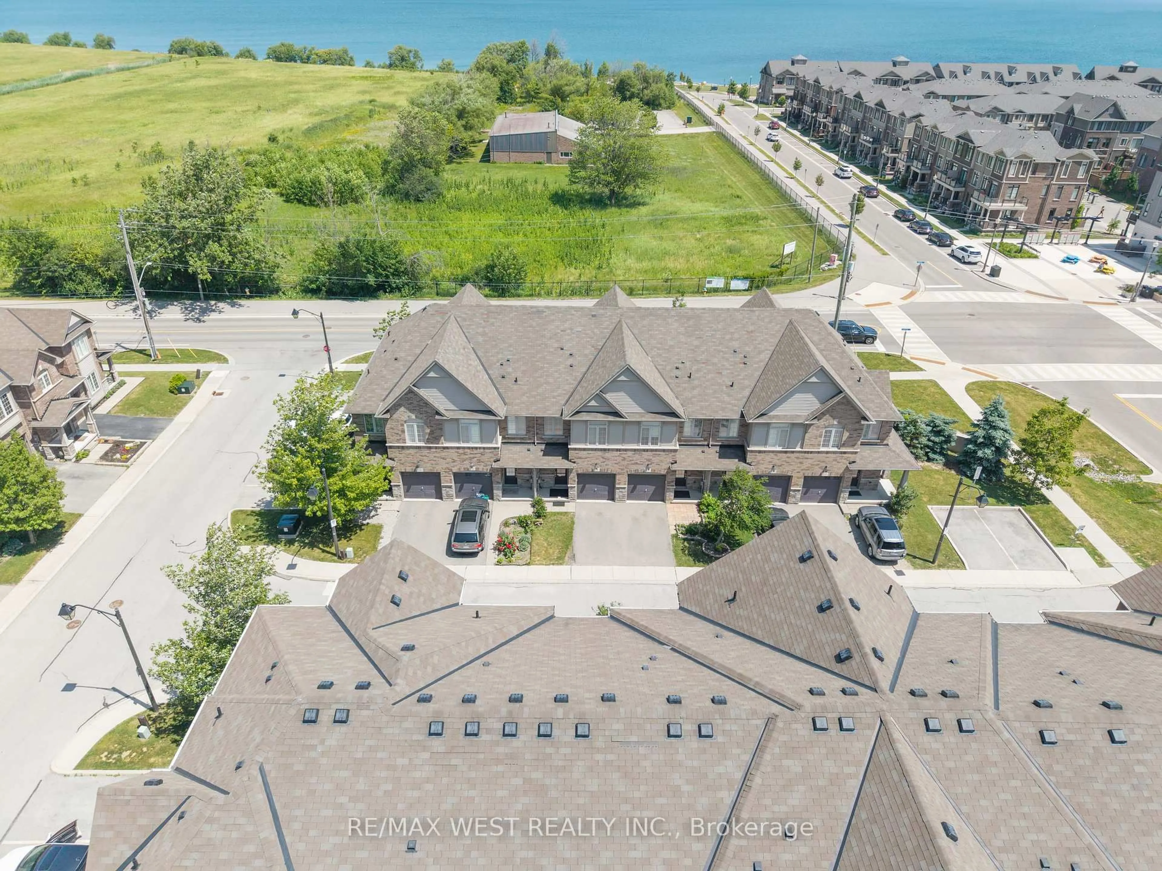 A pic from outside/outdoor area/front of a property/back of a property/a pic from drone, water/lake/river/ocean view for 515 Winston Rd #15, Grimsby Ontario L3M 0C8