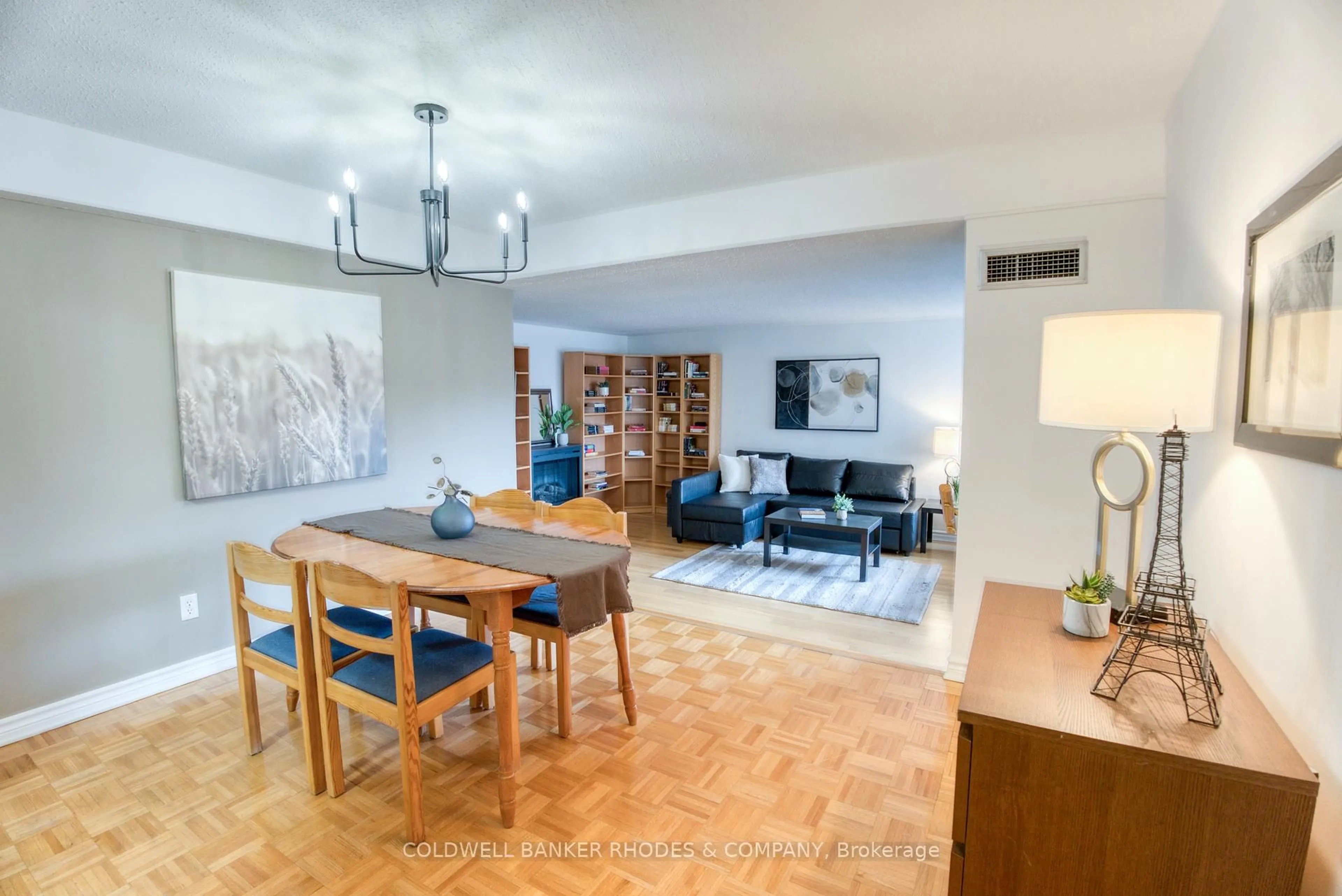 Living room with furniture, wood/laminate floor for 1599 Lassiter Terr #213, Ottawa Ontario K1J 8R6