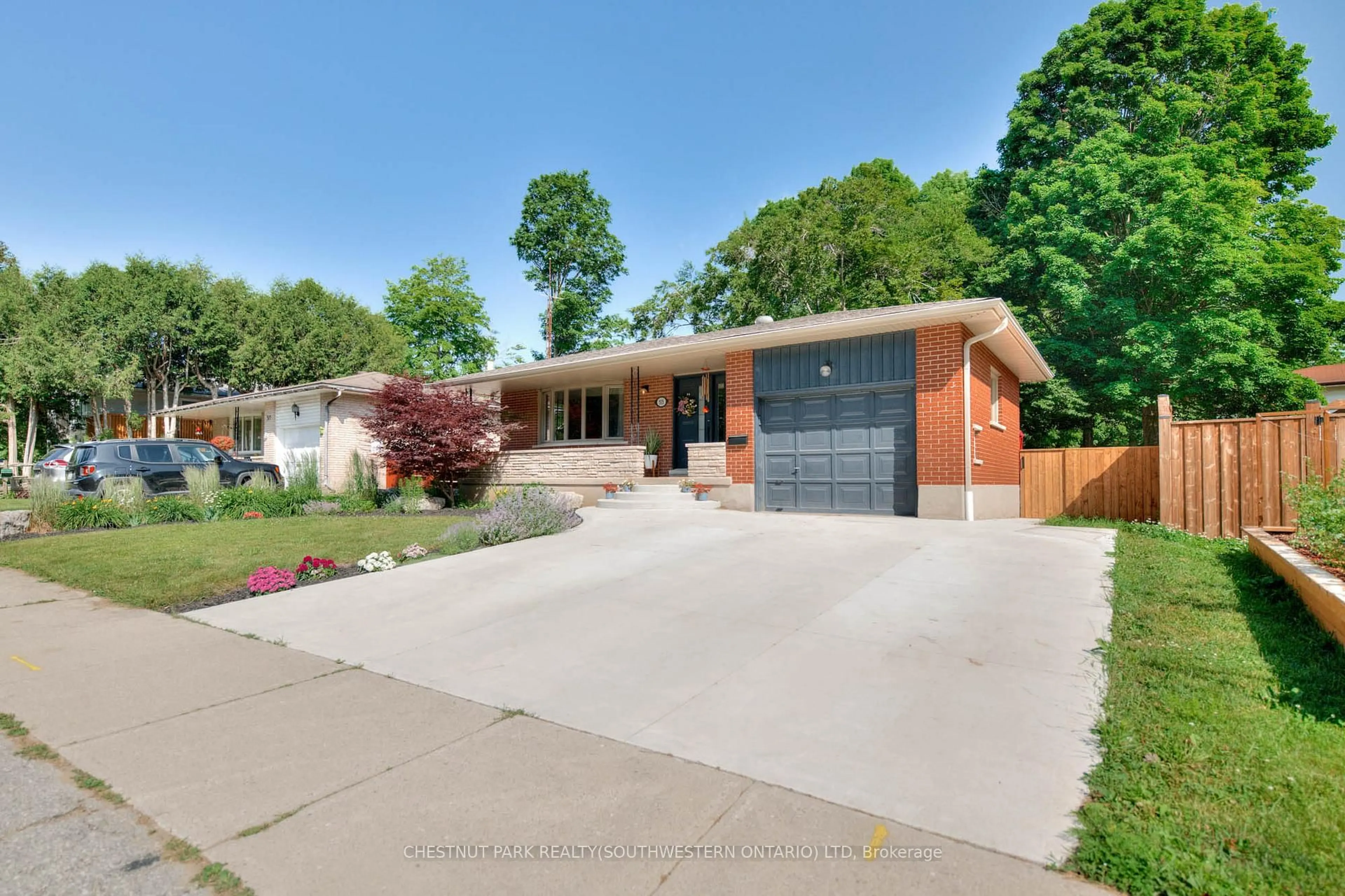 Home with brick exterior material, street for 515 Twin Oaks Cres, Waterloo Ontario N2L 4R9