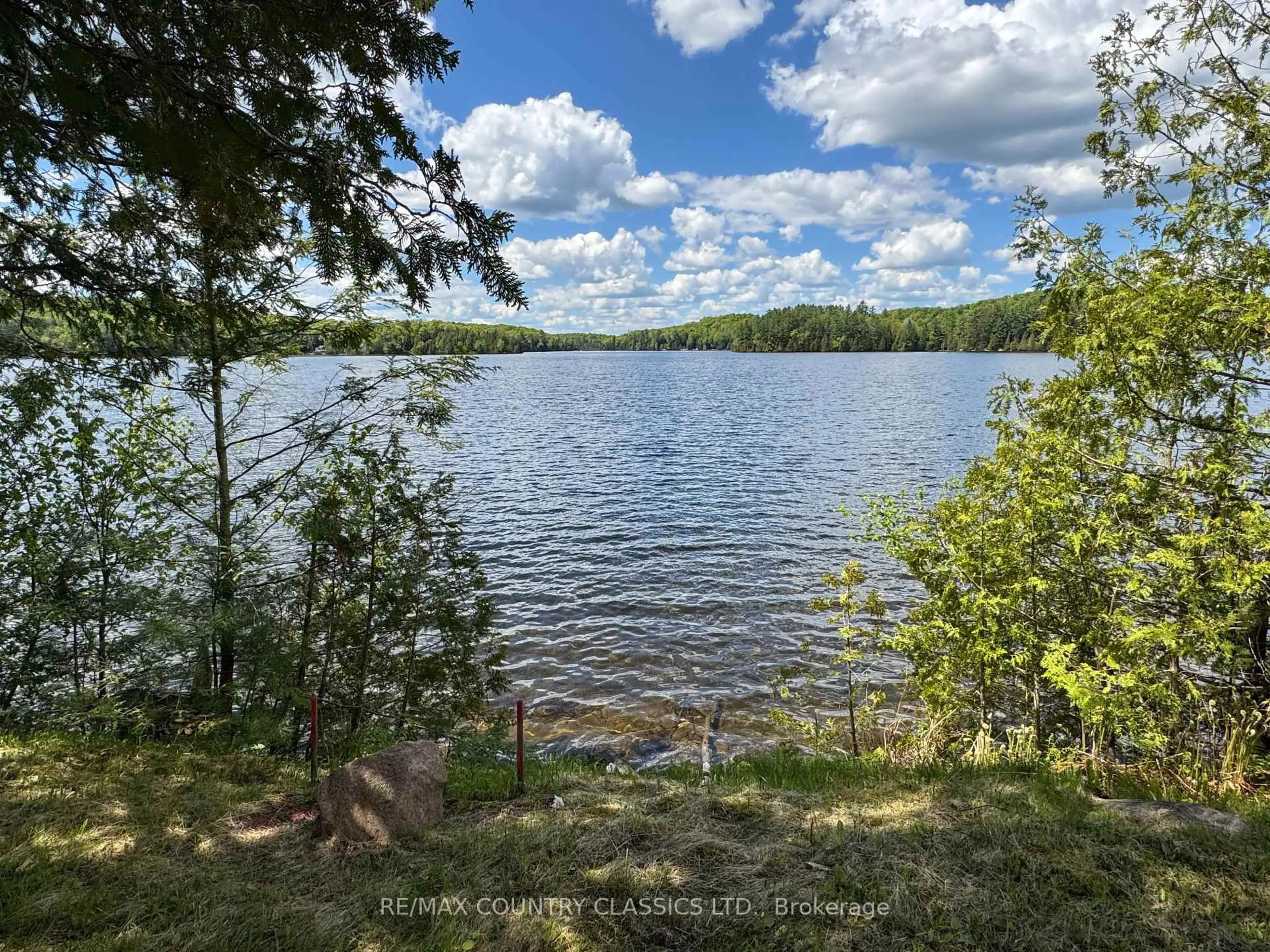 A pic from outside/outdoor area/front of a property/back of a property/a pic from drone, water/lake/river/ocean view for 27241 Highway 28, Highlands East Ontario K0L 1M0
