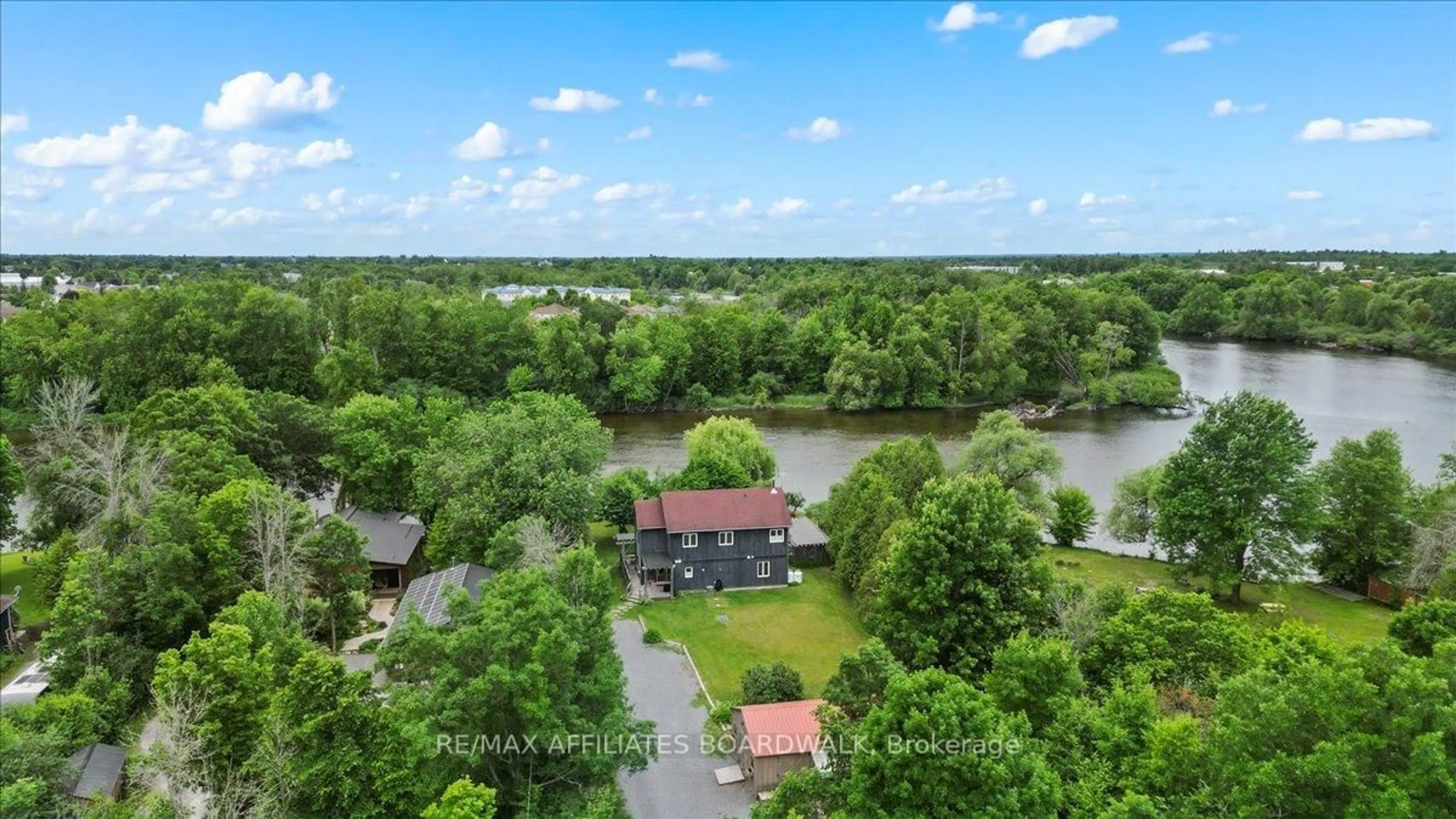 A pic from outside/outdoor area/front of a property/back of a property/a pic from drone, water/lake/river/ocean view for 115 Patty Lane, Carleton Place Ontario K7C 3P1