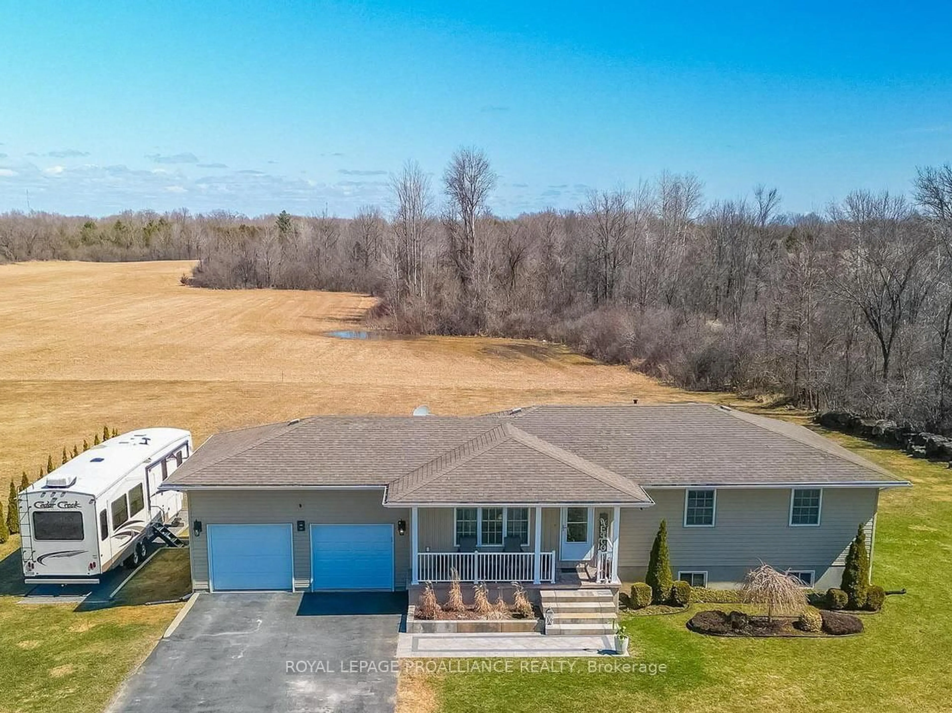 A pic from outside/outdoor area/front of a property/back of a property/a pic from drone, water/lake/river/ocean view for 1302 Rapids Rd, Tweed Ontario K0K 3J0