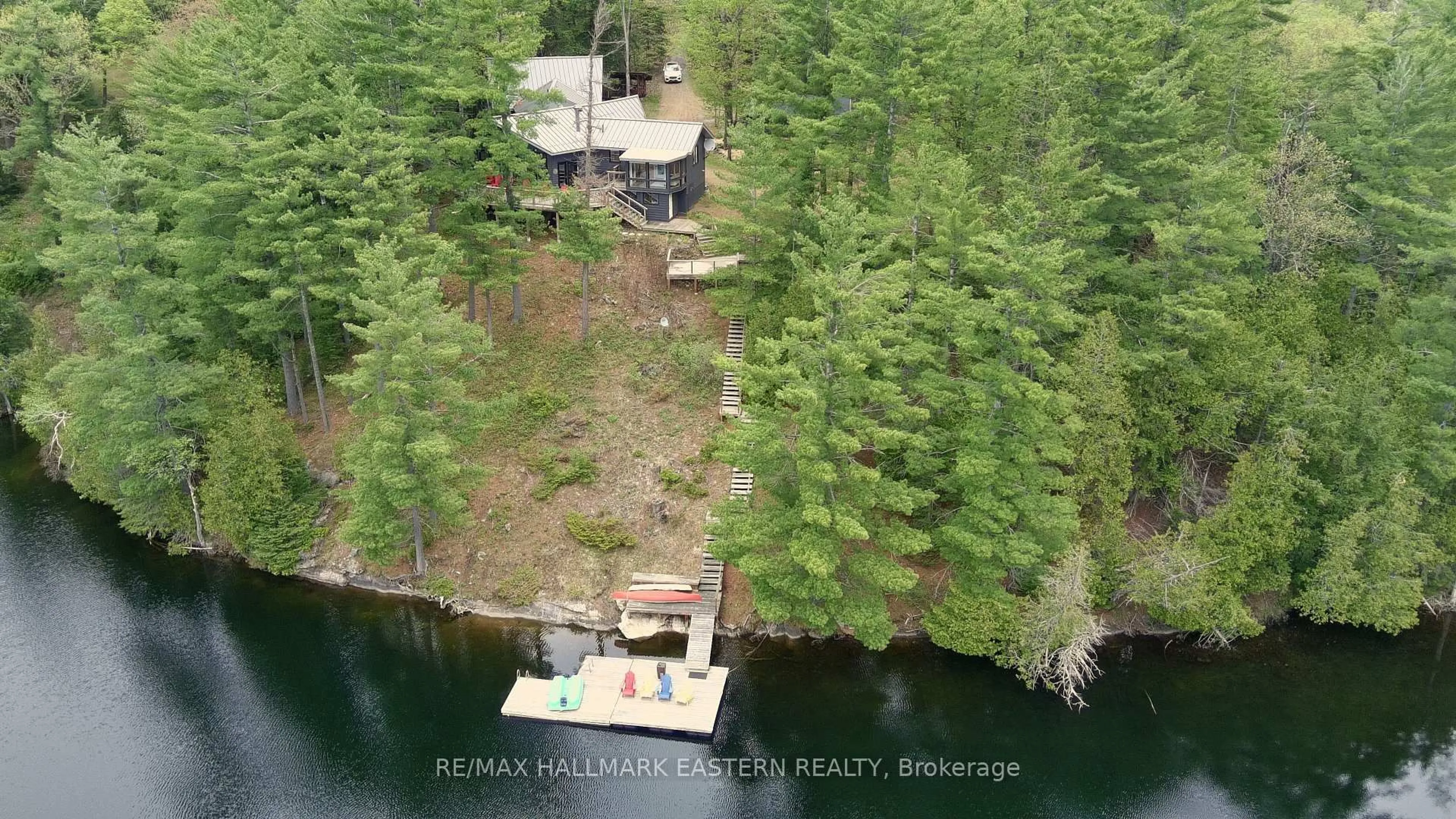 A pic from outside/outdoor area/front of a property/back of a property/a pic from drone, water/lake/river/ocean view for 69 Alexander Crt, Trent Lakes Ontario K0L 1J0