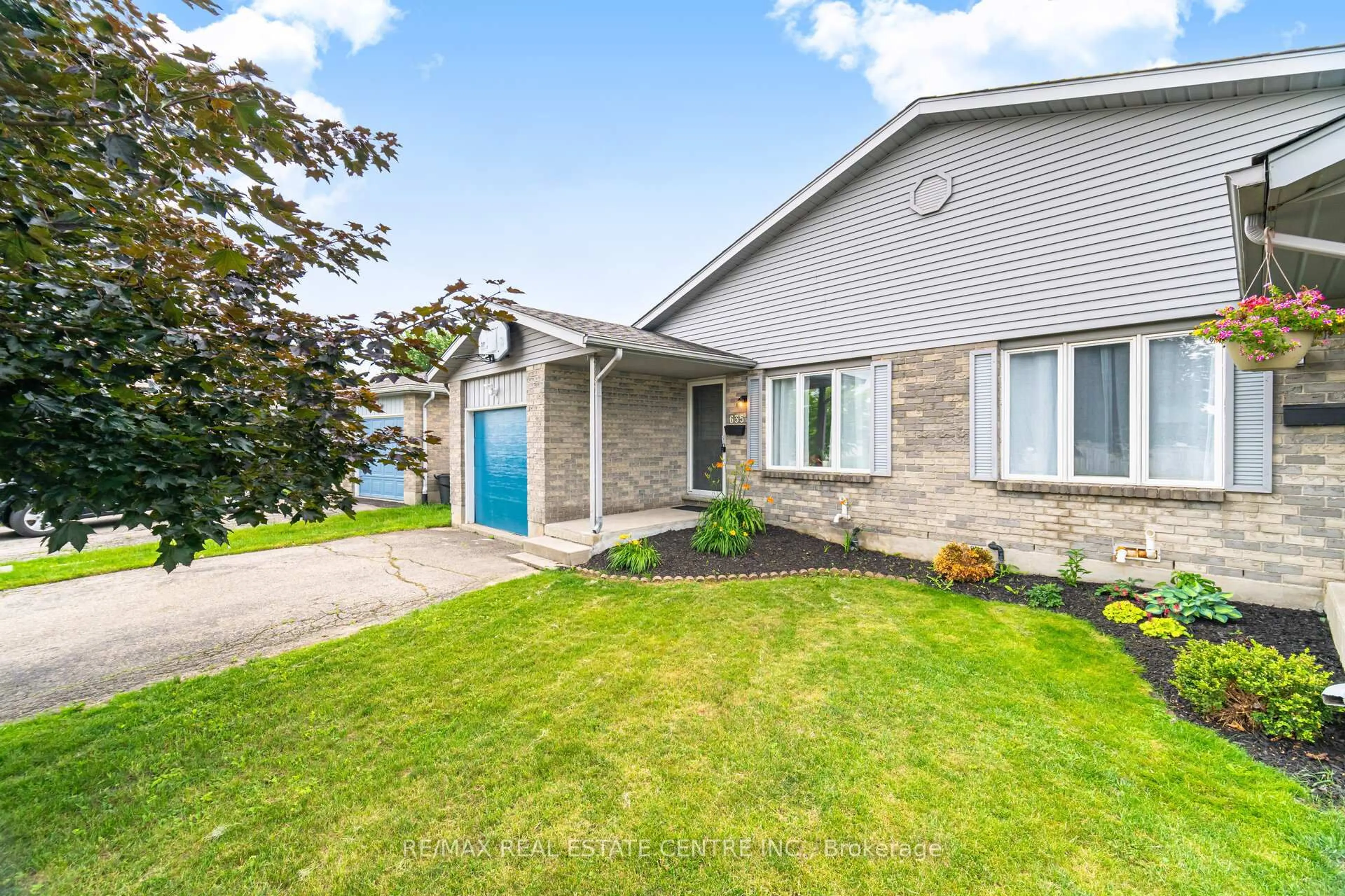 Home with vinyl exterior material, street for 635A Rummelhardt Dr, Waterloo Ontario N2T 2K4
