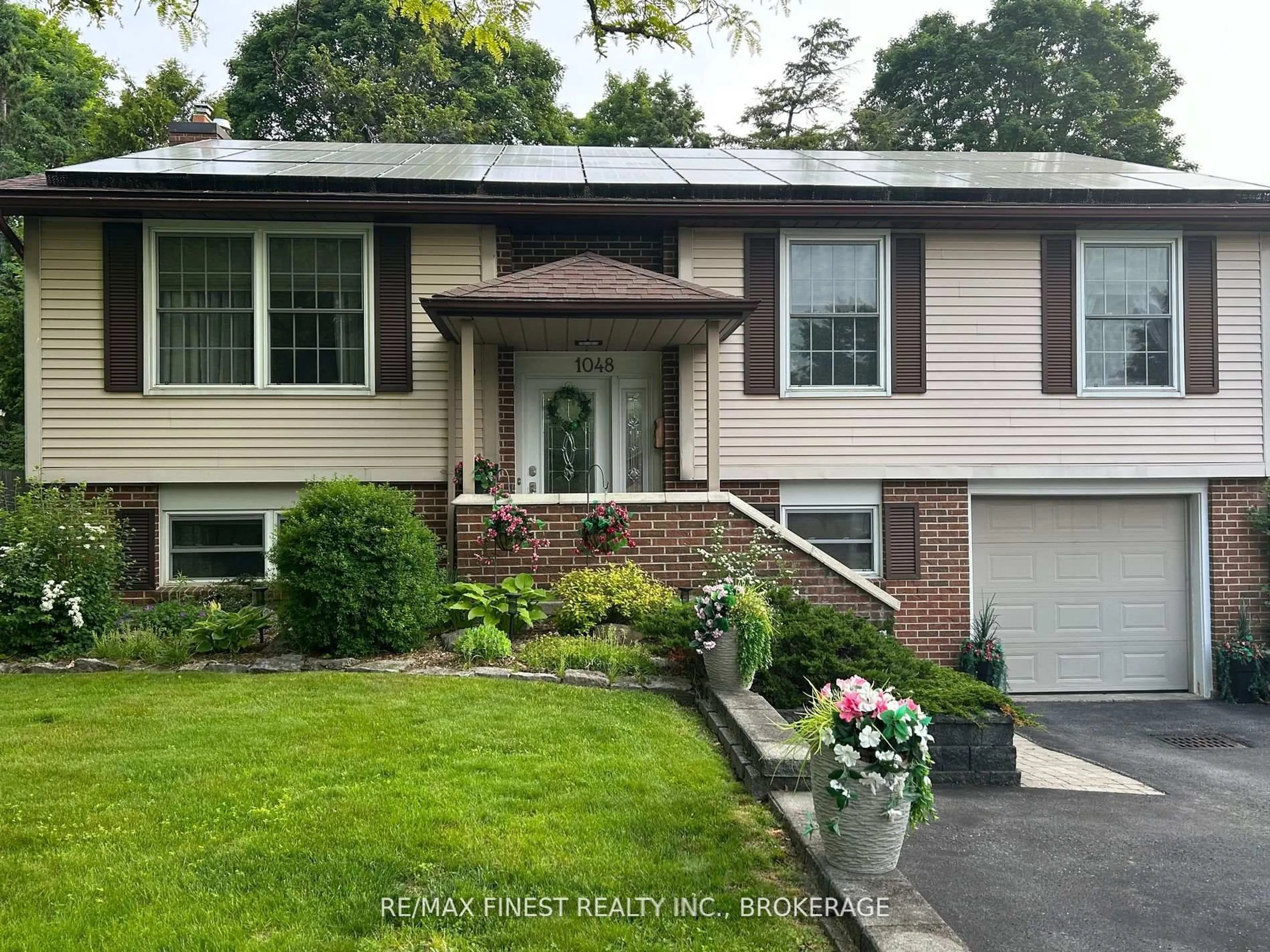 Home with vinyl exterior material, street for 1048 Bauder Cres, Kingston Ontario K7P 1M6