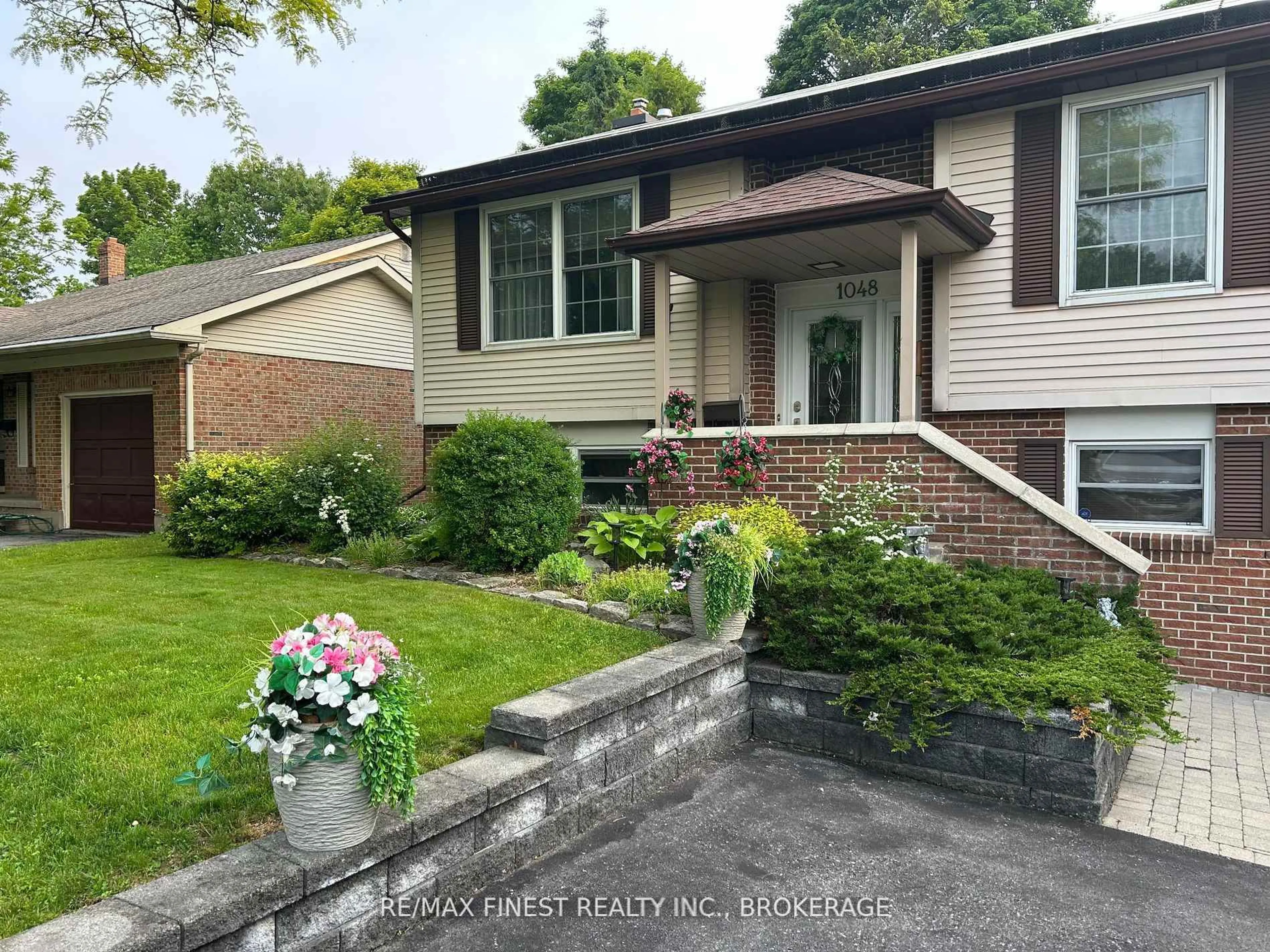 Home with brick exterior material, street for 1048 Bauder Cres, Kingston Ontario K7P 1M6