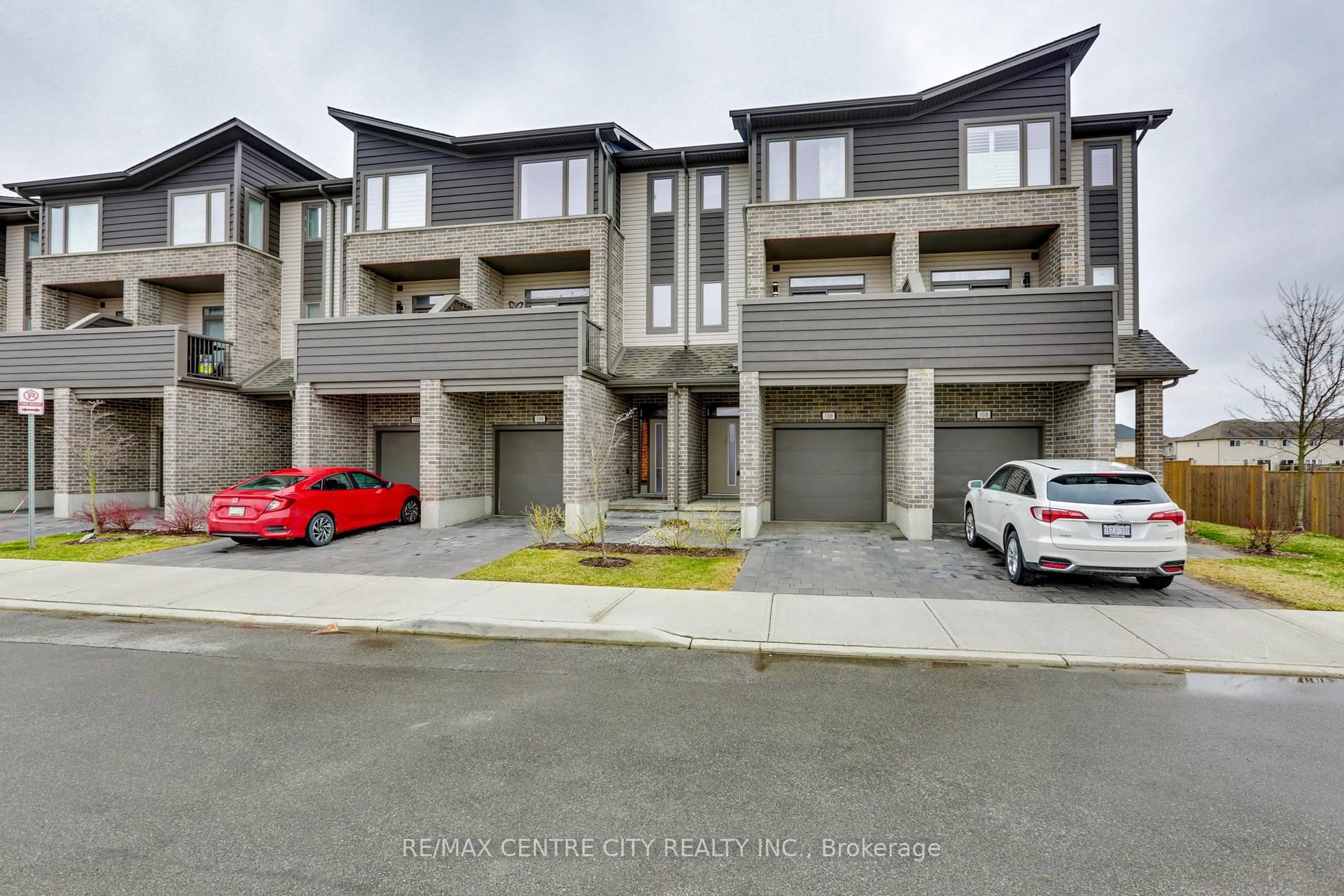 A pic from outside/outdoor area/front of a property/back of a property/a pic from drone, street for 2070 Meadowgate Blvd #106, London South Ontario N6M 1C6