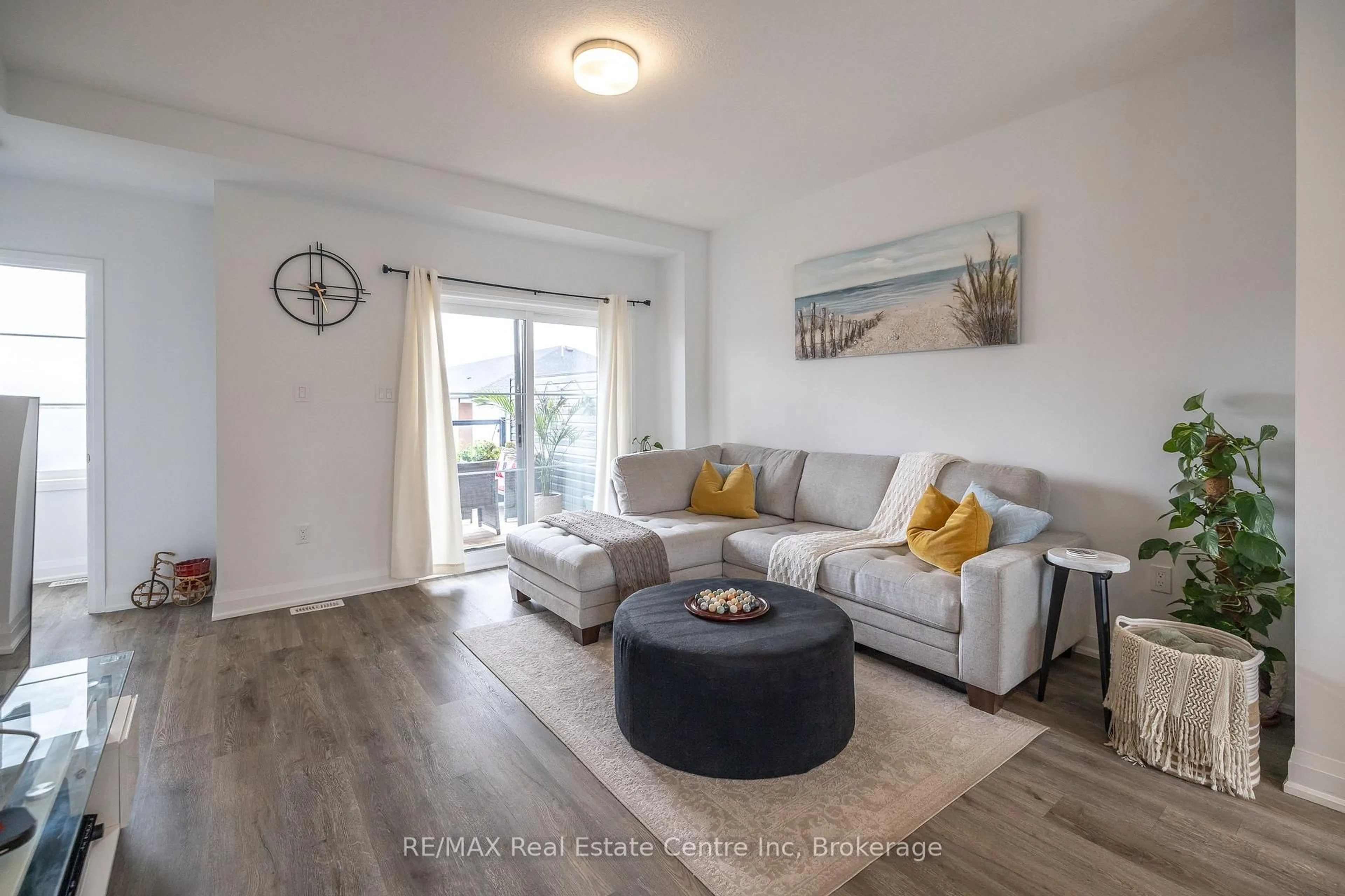 Living room with furniture, wood/laminate floor for 170 Huron St, Guelph Ontario N1E 0S7