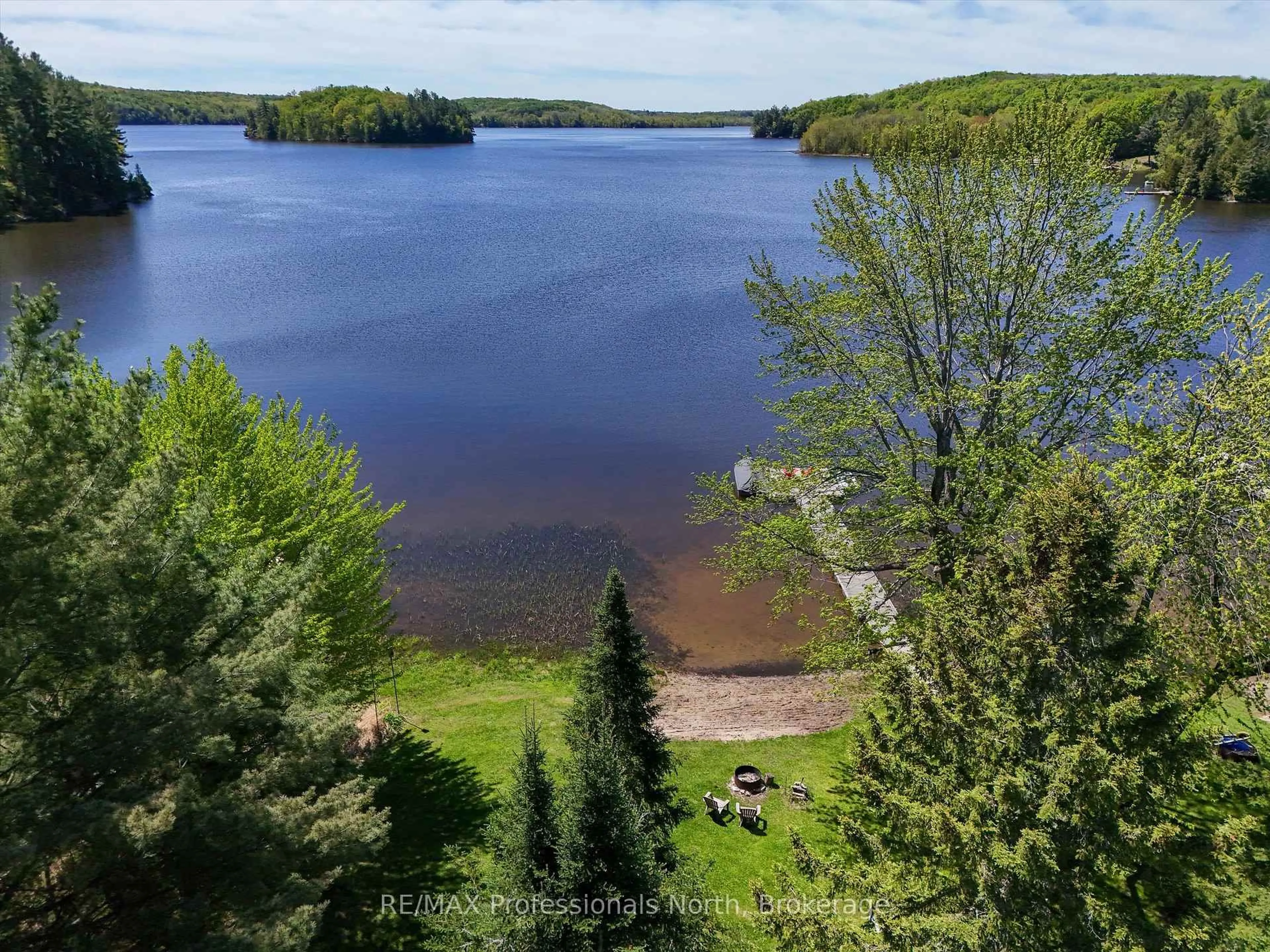 A pic from outside/outdoor area/front of a property/back of a property/a pic from drone, water/lake/river/ocean view for 1020 Cove Rd, Muskoka Lakes Ontario P0B 1M0
