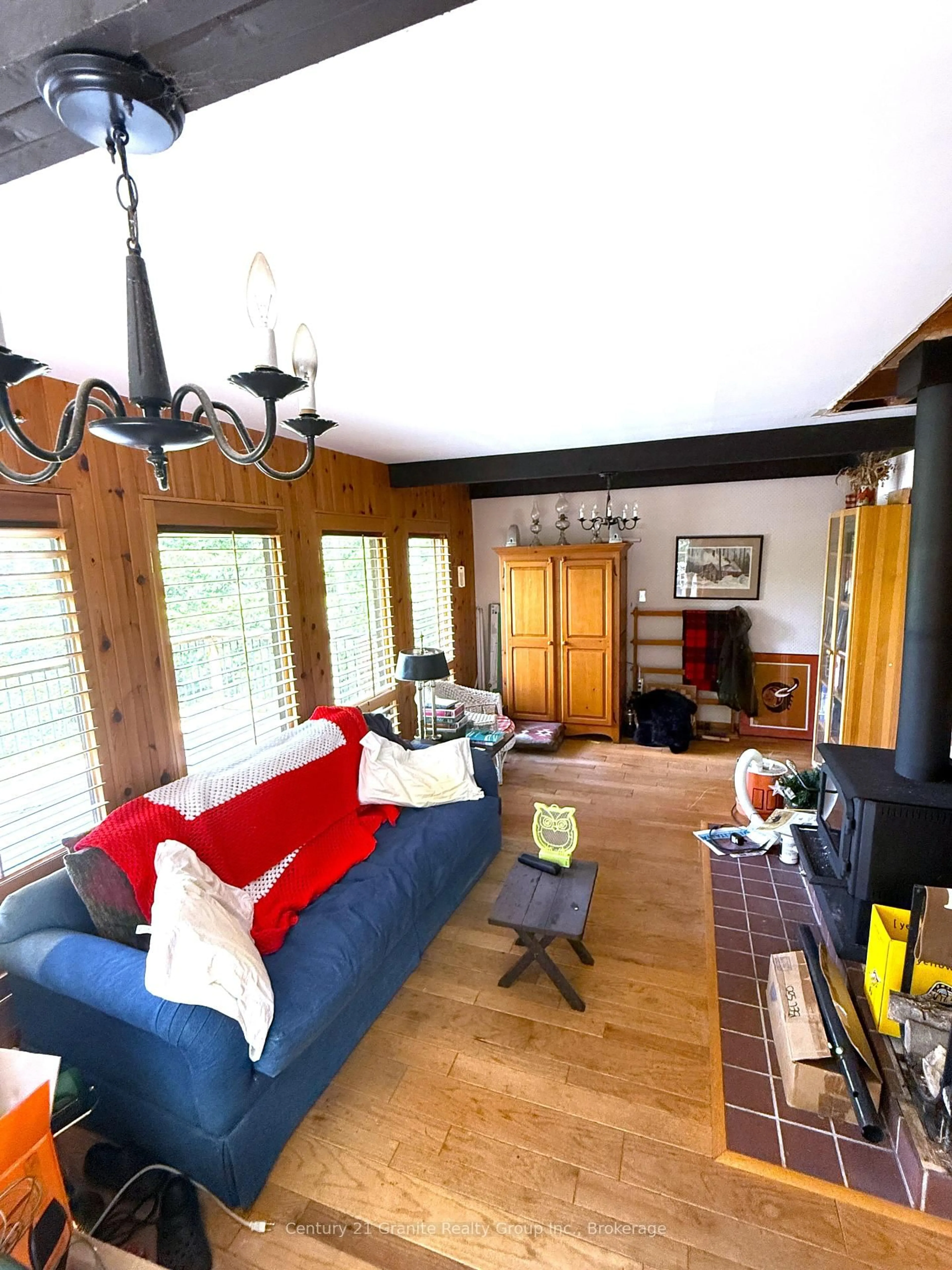 Living room with furniture, wood/laminate floor for 1297 Watts Rd, Dysart et al Ontario K0M 1S0