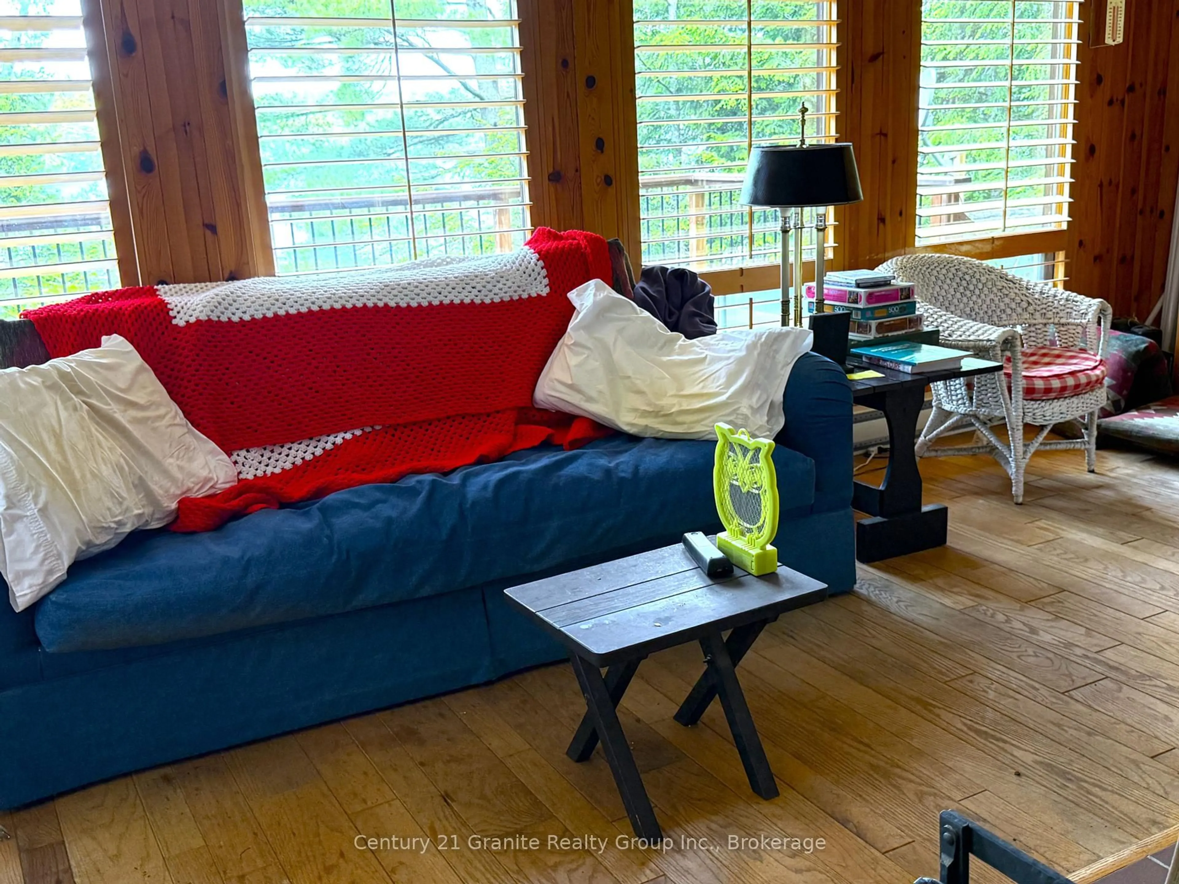 Living room with furniture, wood/laminate floor for 1297 Watts Rd, Dysart et al Ontario K0M 1S0